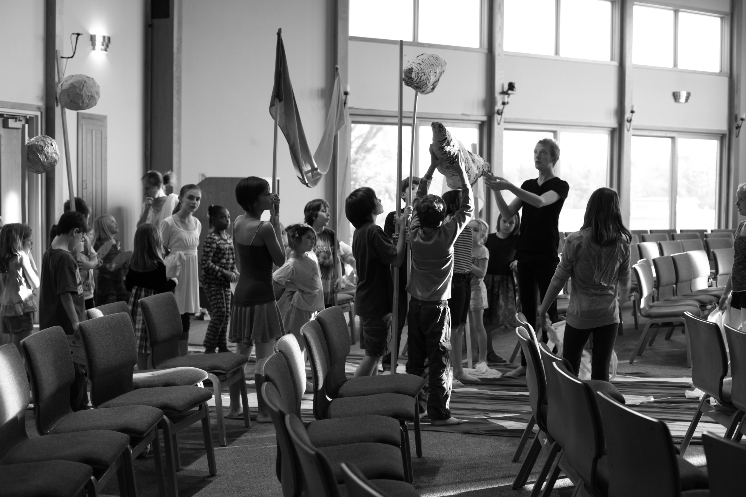 BOOM. Children rehearse their version of the Big Bang in this new, postmodern, puppet musical with music by Lauren Bernofsky and text by Clare Hammoor. The production, which was commissioned by the Unitarian Universalist Church of Bloomington, deconstructed four creation myths from around the globe. Designed and directed by Clare Hammoor. Photo by Lauren Bernofsky.