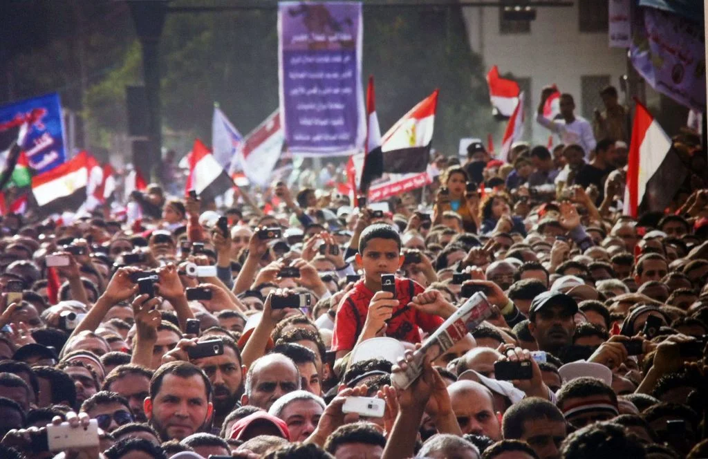 Protesters during a speech in Tahrir Square, April 8, 2011. Photo by Mosa’ab Elshamy. © Mosa’ab Elshamy. Shared courtesy of Lara Baladi.