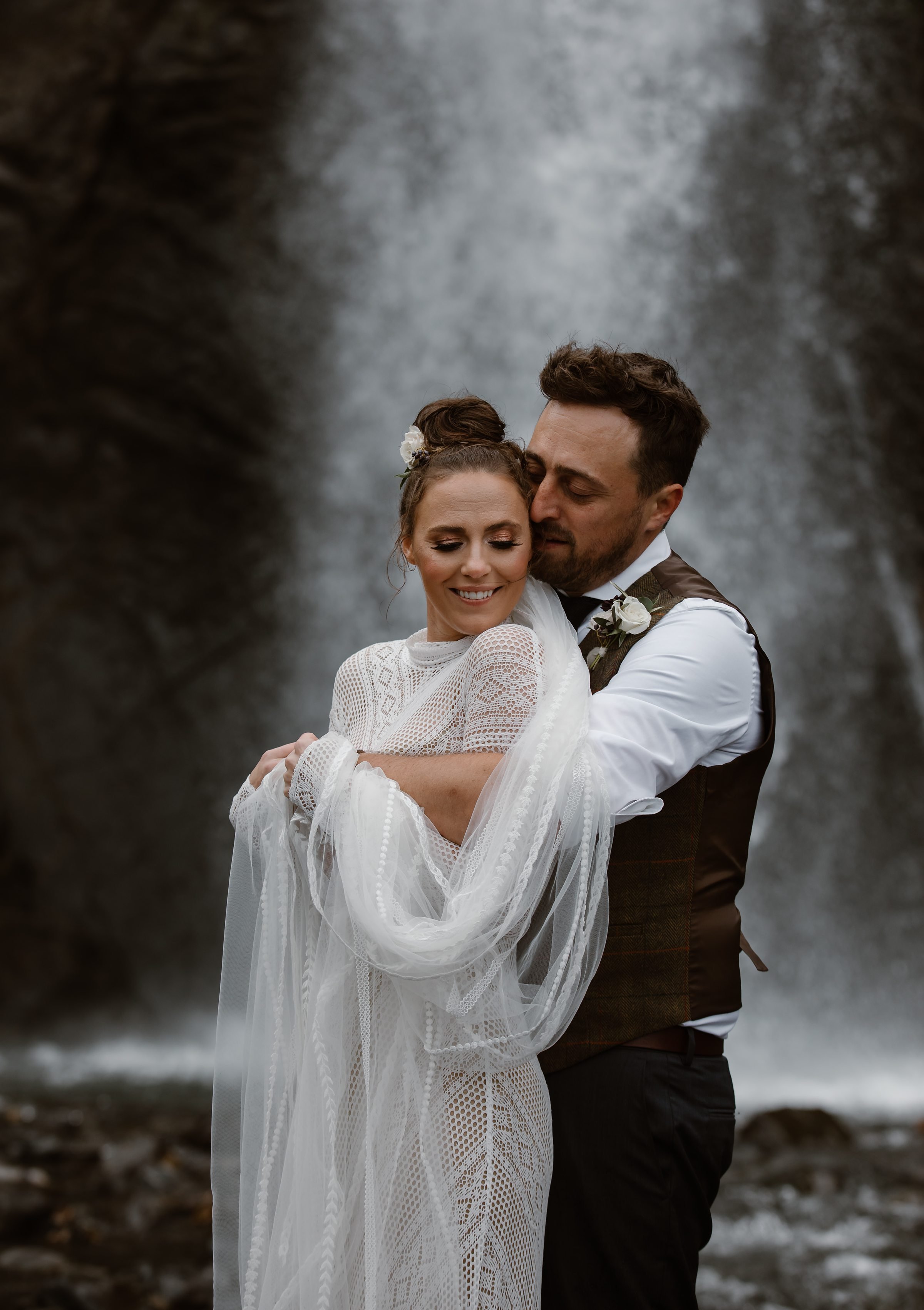  bride and groom portraits with waterfall 