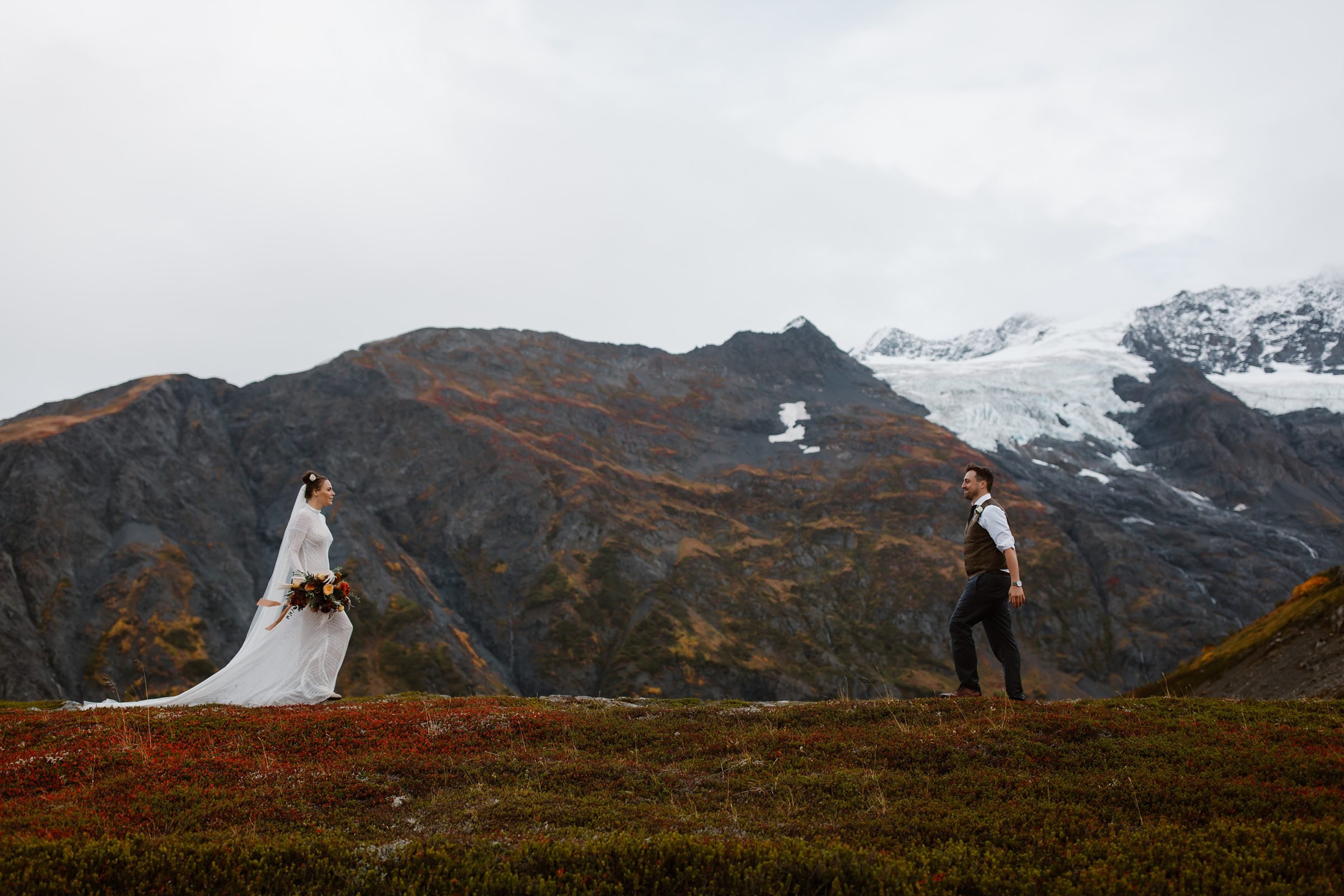  bride and groom on mountain in alaska 