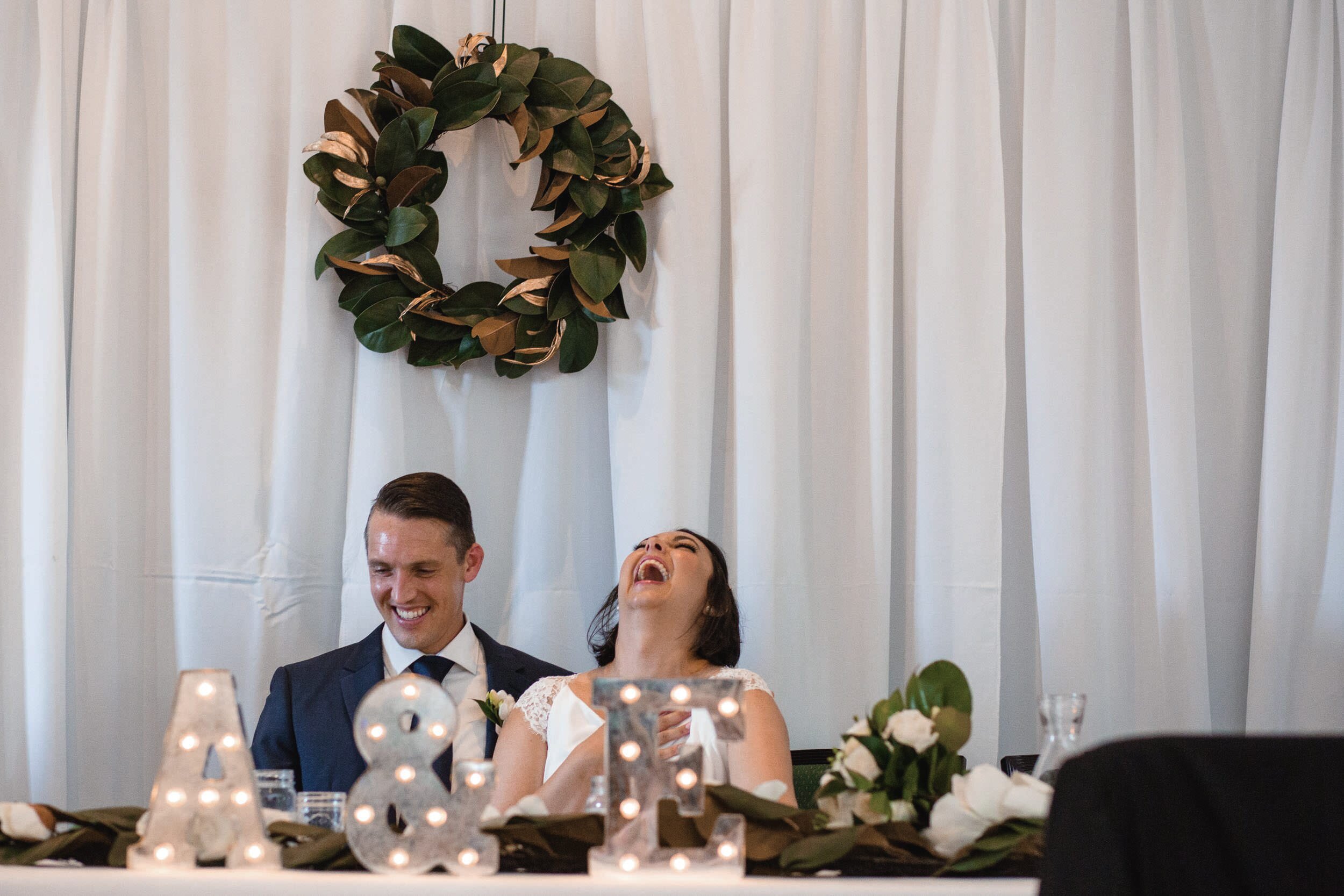 bride-laughing-during-toasts.jpg