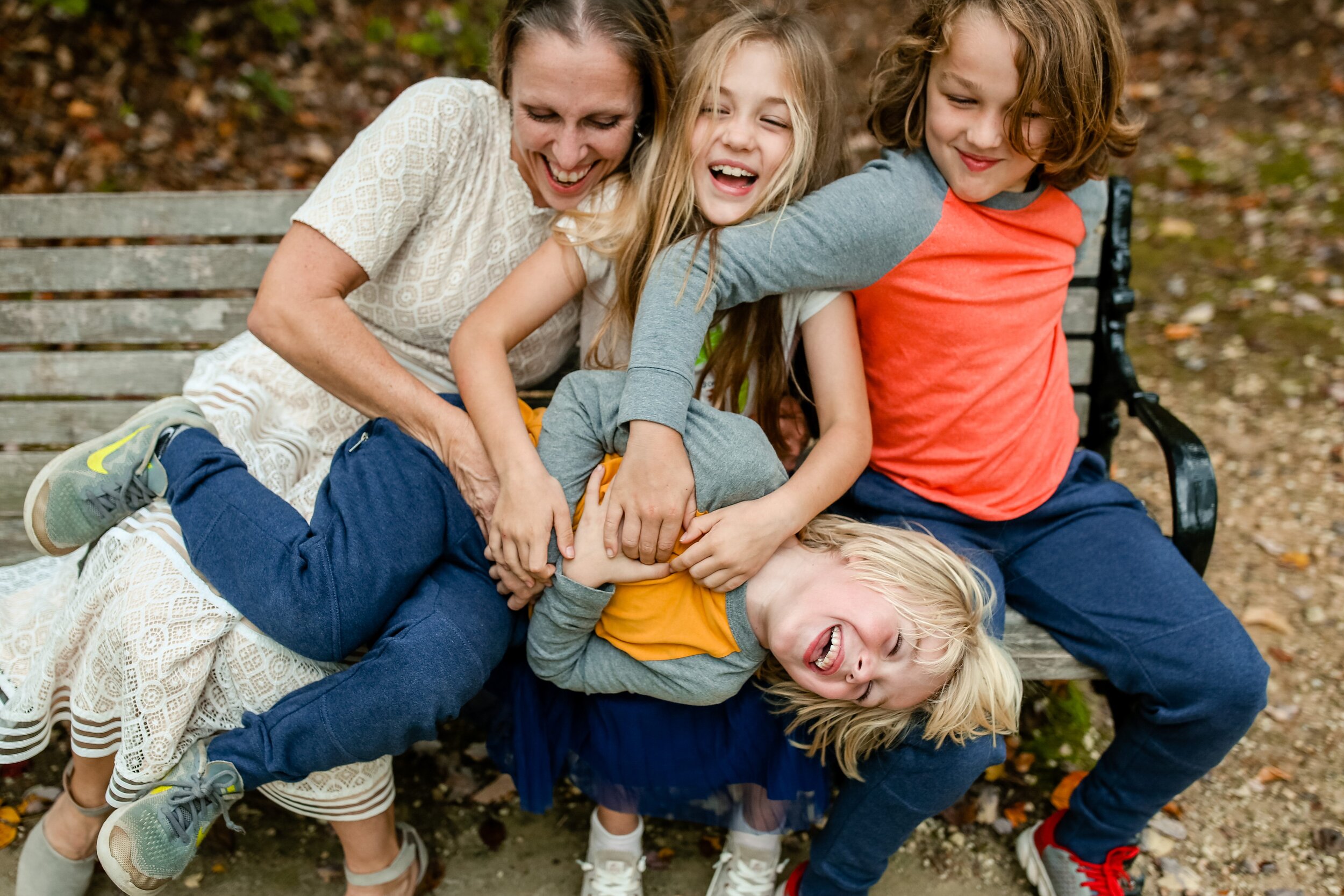 family-laughing-on-bench-in-alexandria-va.jpg