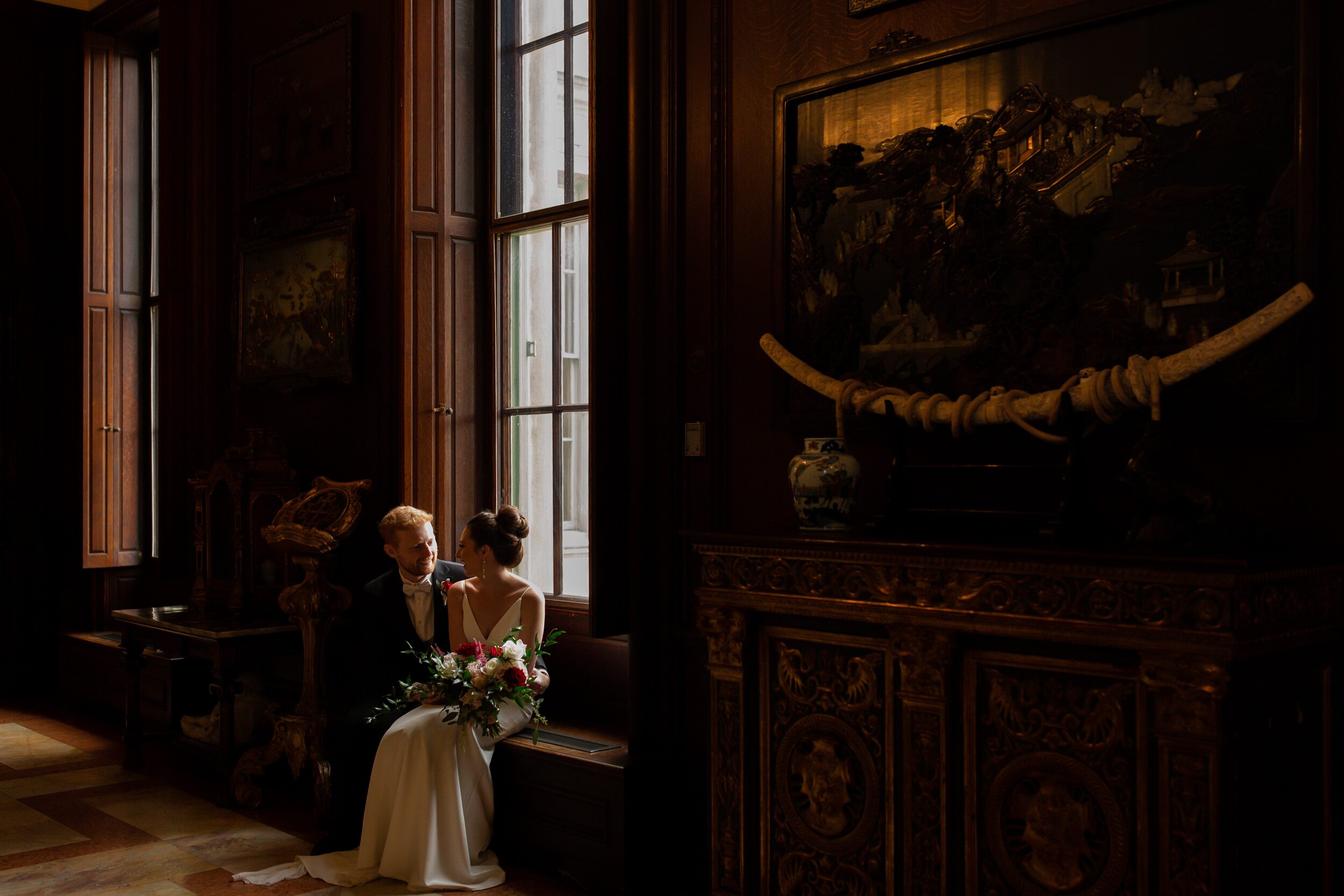couple-sitting-before-ceremony-at-anderson-house.jpg