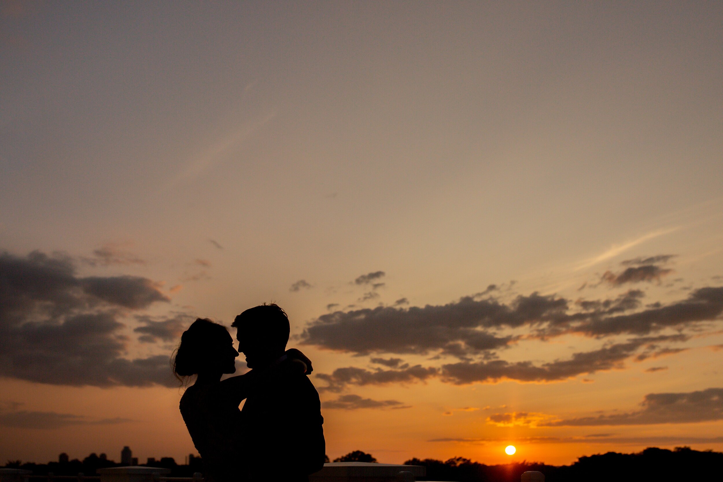 sunset-with-wedding-couple-huging-arlington-va.jpg