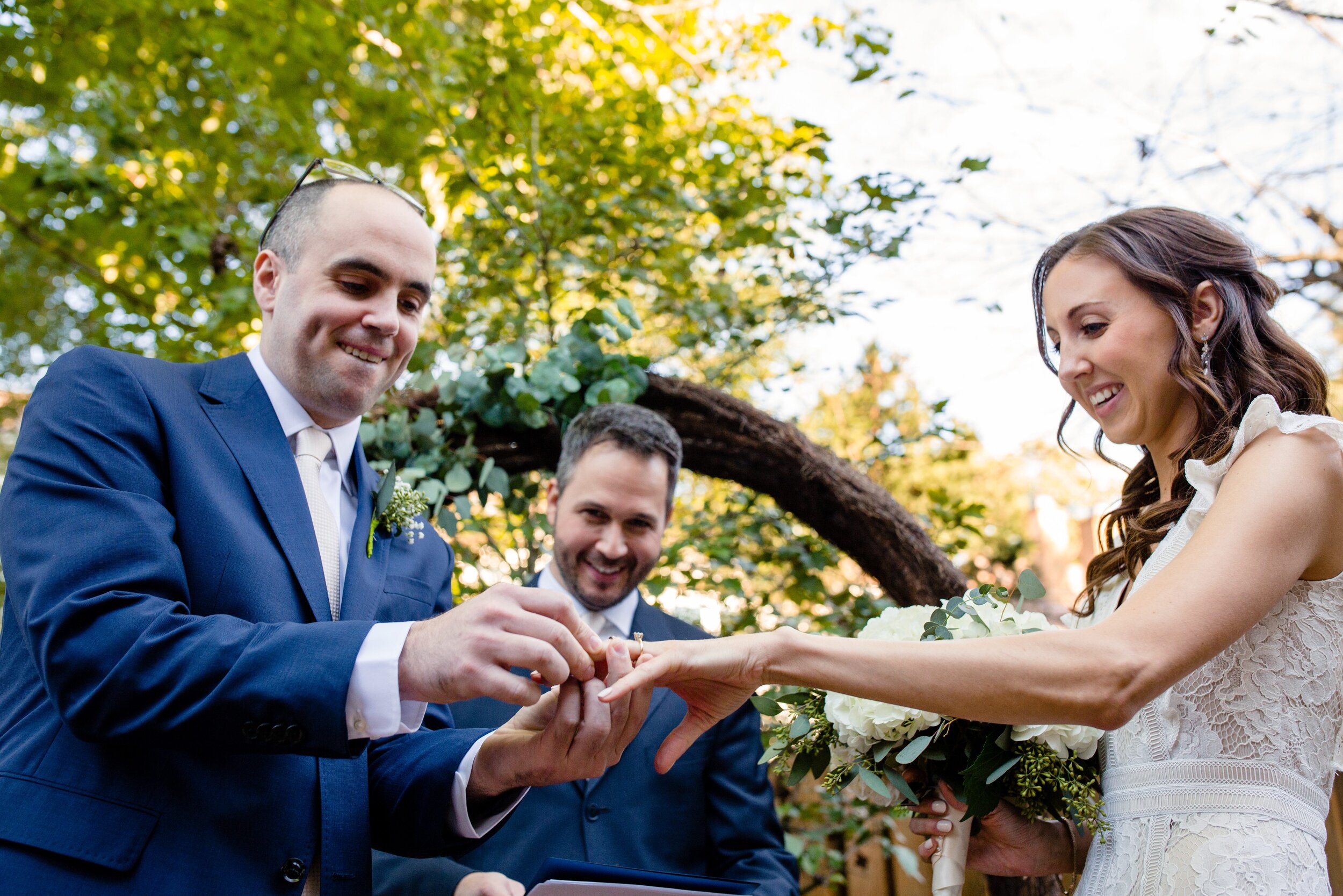 groom-putting-on-wedding-ring.jpg