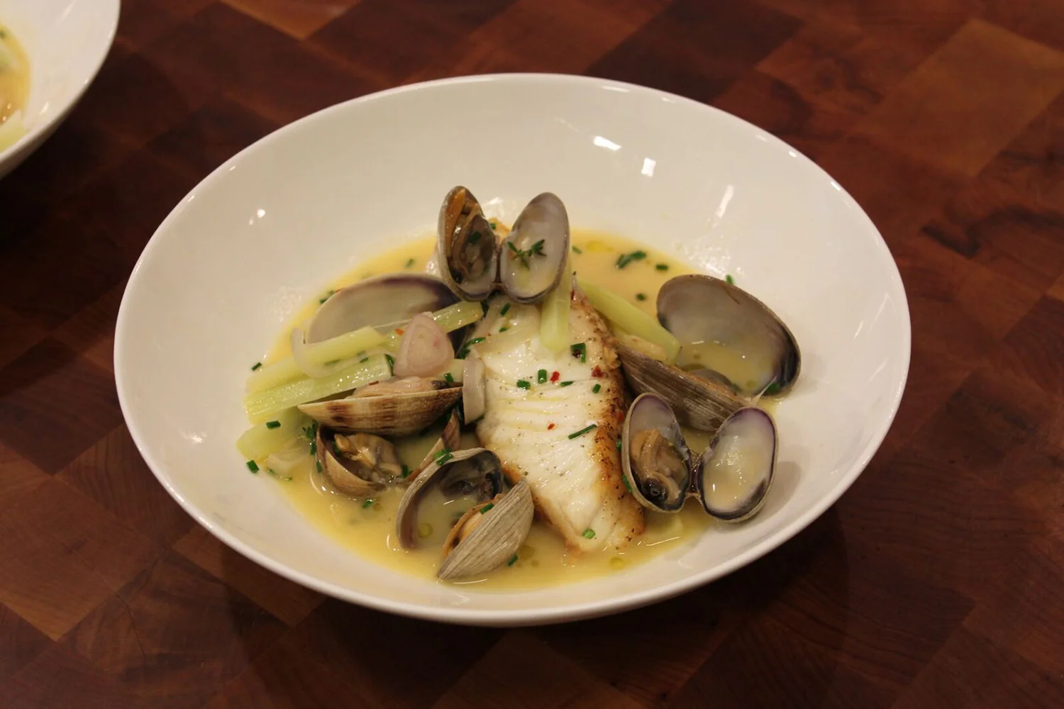 Baked Wild Pacific Halibut with Spicy Clam Broth, Summer Squash, and Celery