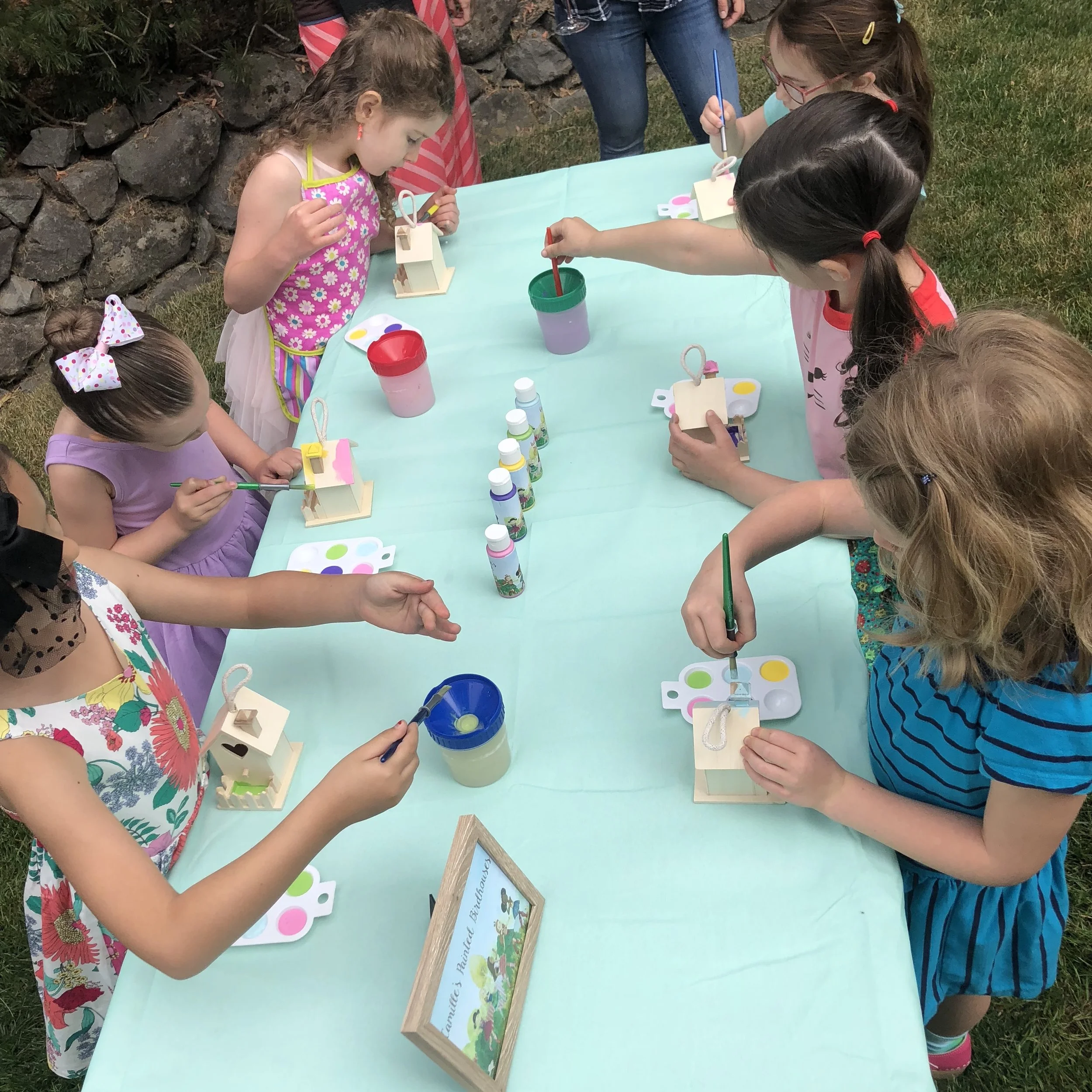 Party guests painted birdhouses at the first activity station.