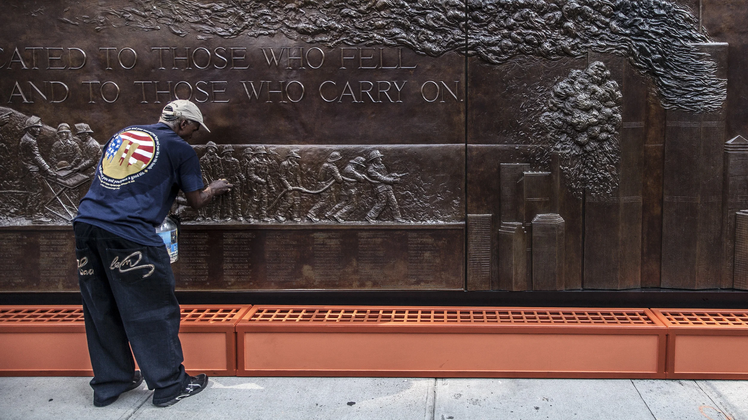 11 September, 2013 - New York, U.S.A. Memorial at New York Fire Department Company 10 at the foot of World Trade Center One, is cleaned in preparation for 12th anniversary services