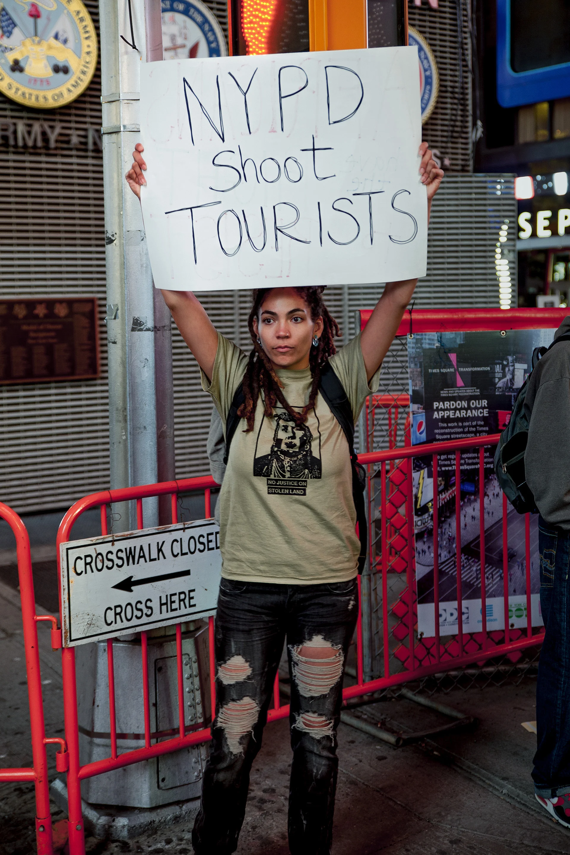 September, 2013 - New York, U.S.A. Protester in Times Square where earlier police fired upon Glenn Broadnax, 35, of Brooklyn, who was later found to be unarmed. Broadnax was unharmed however two tourist bystanders were wounded