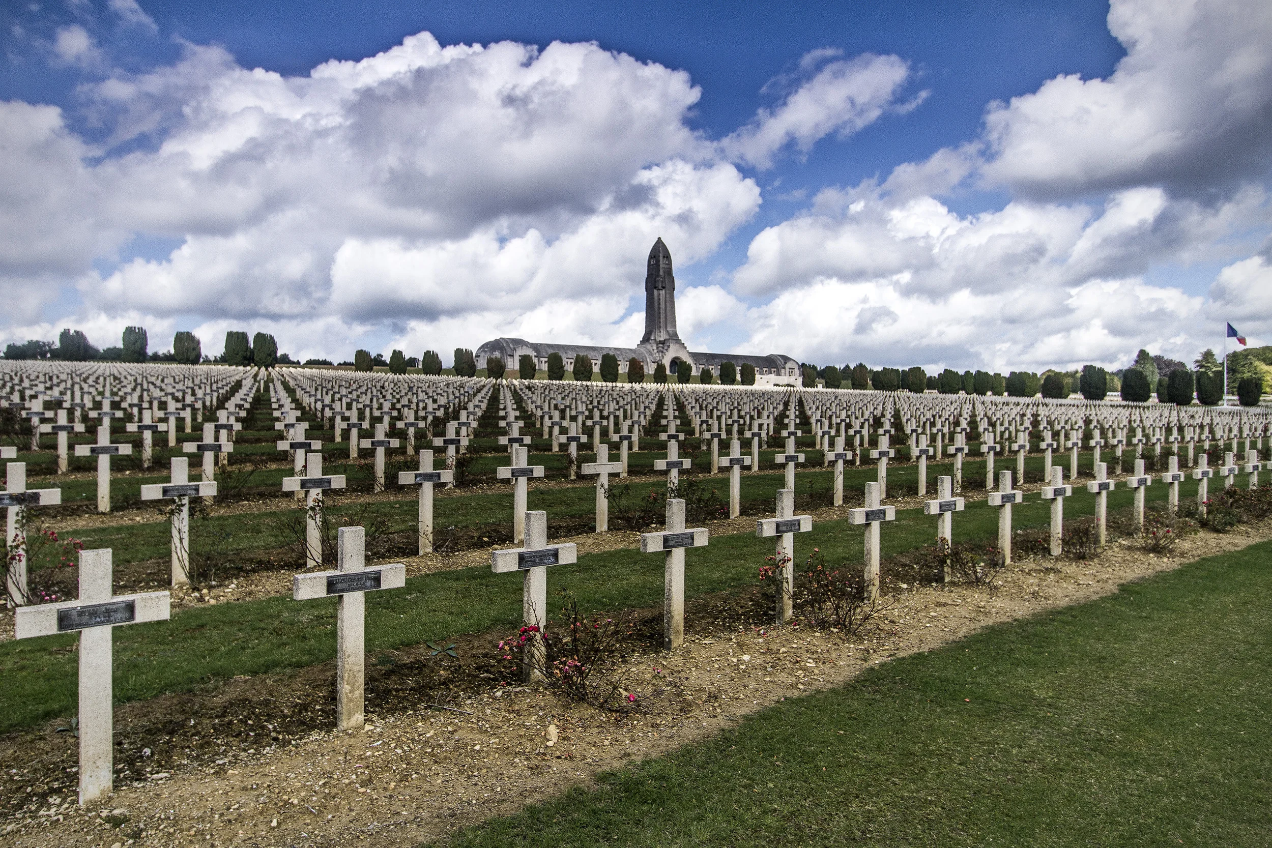Normal
0
false
false
false
EN-US
X-NONE
X-NONE
L’ossuaire de Douaumont L’ossuaire de Douaumont, the single largest French military cemetery of the First World War with 16,142 graves, the majority from the 300 day 'Battle of Verdun' in 1916. In the Ossuary itself the skeletal remains of another 130,000 unidentified French and German soldiers can be viewed through small windows at the buildings rear. The design of the building itself is based upon the hilt of a sword plunged into the earth with the skeletal remains beneath it forming the blade.