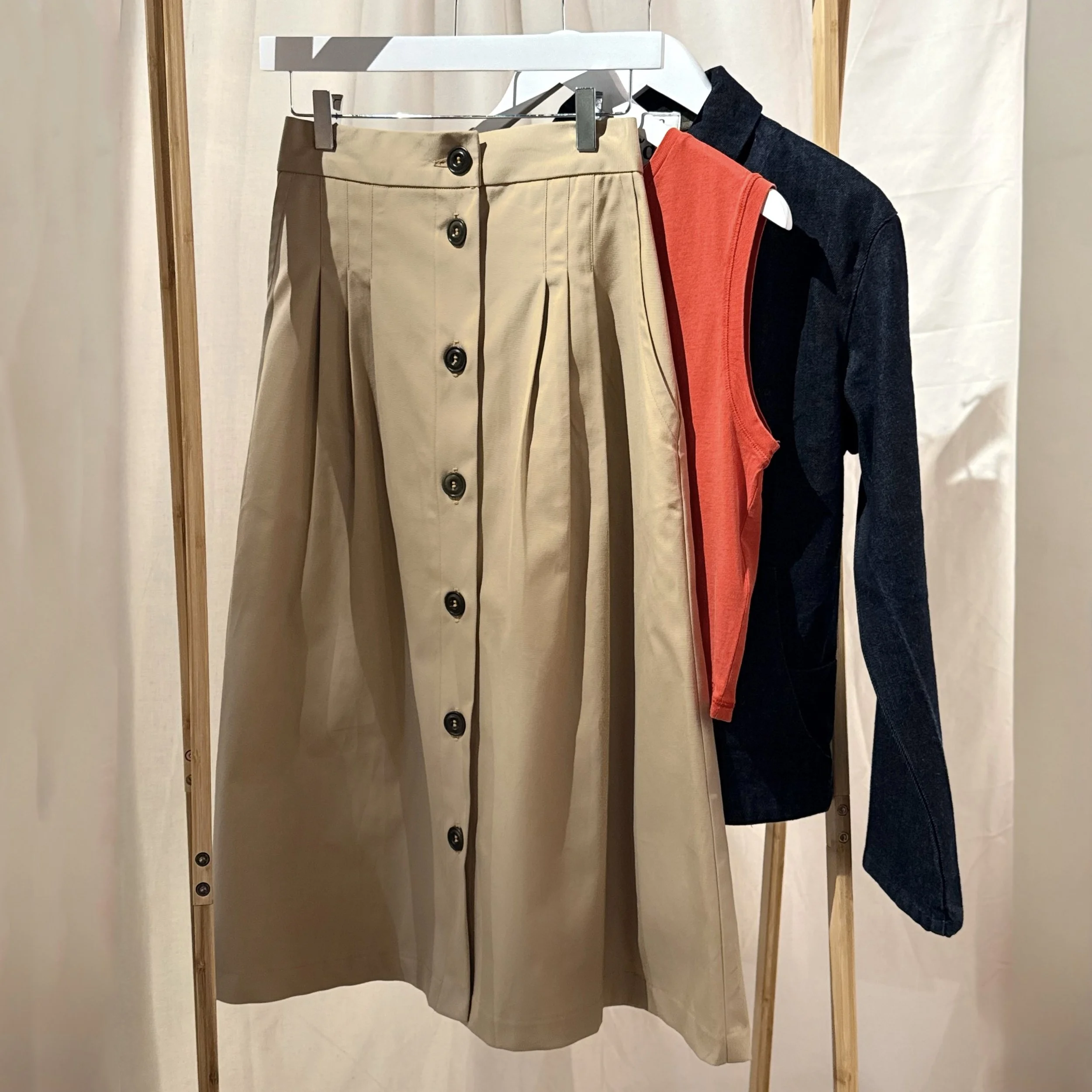 tan skirt with red vest and maurais jacket  copy.jpg