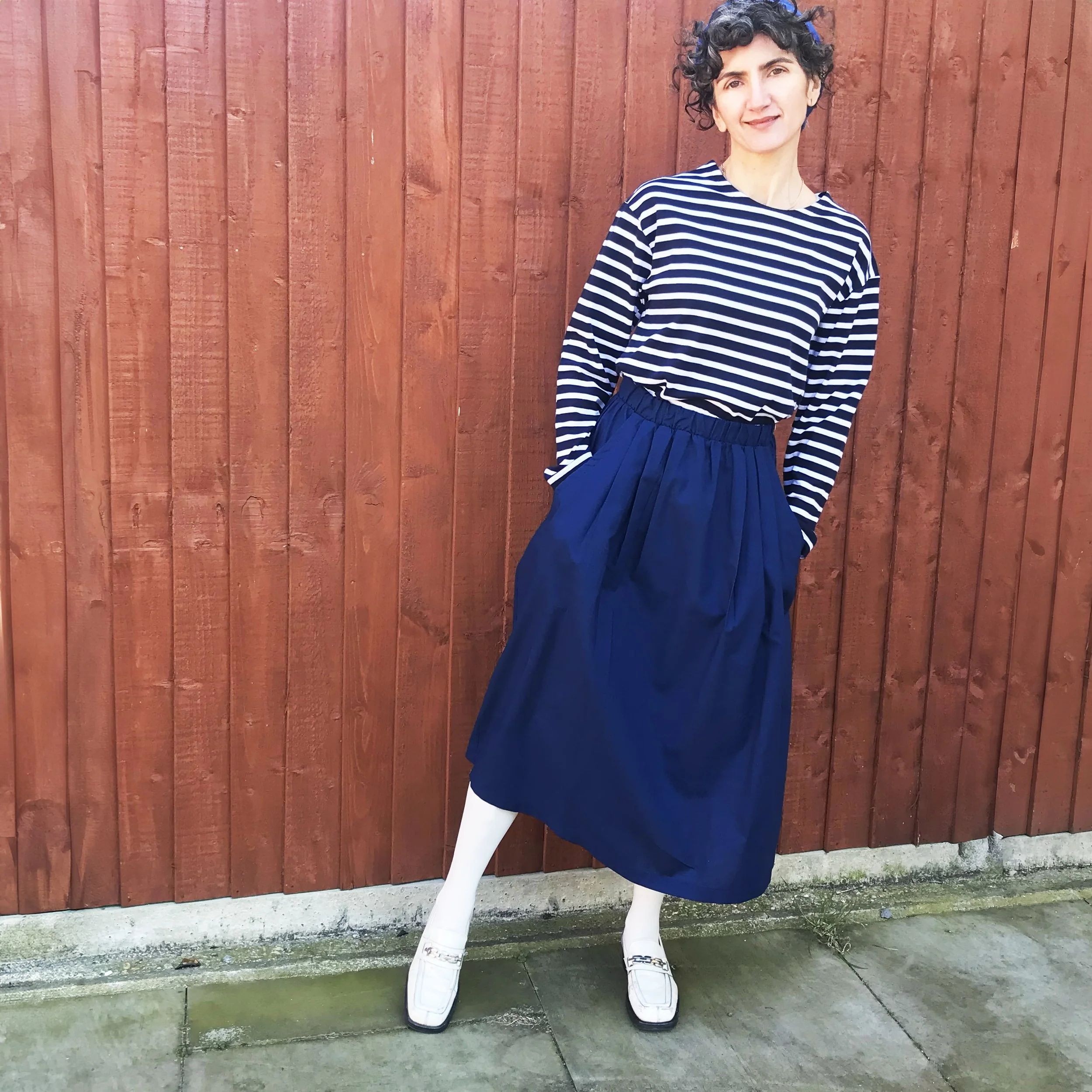 sonia in skirt and stripe top.jpg