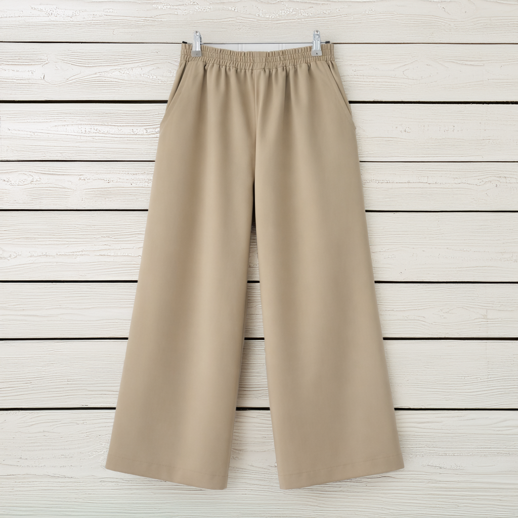 Beige trousers on clear hanger.png