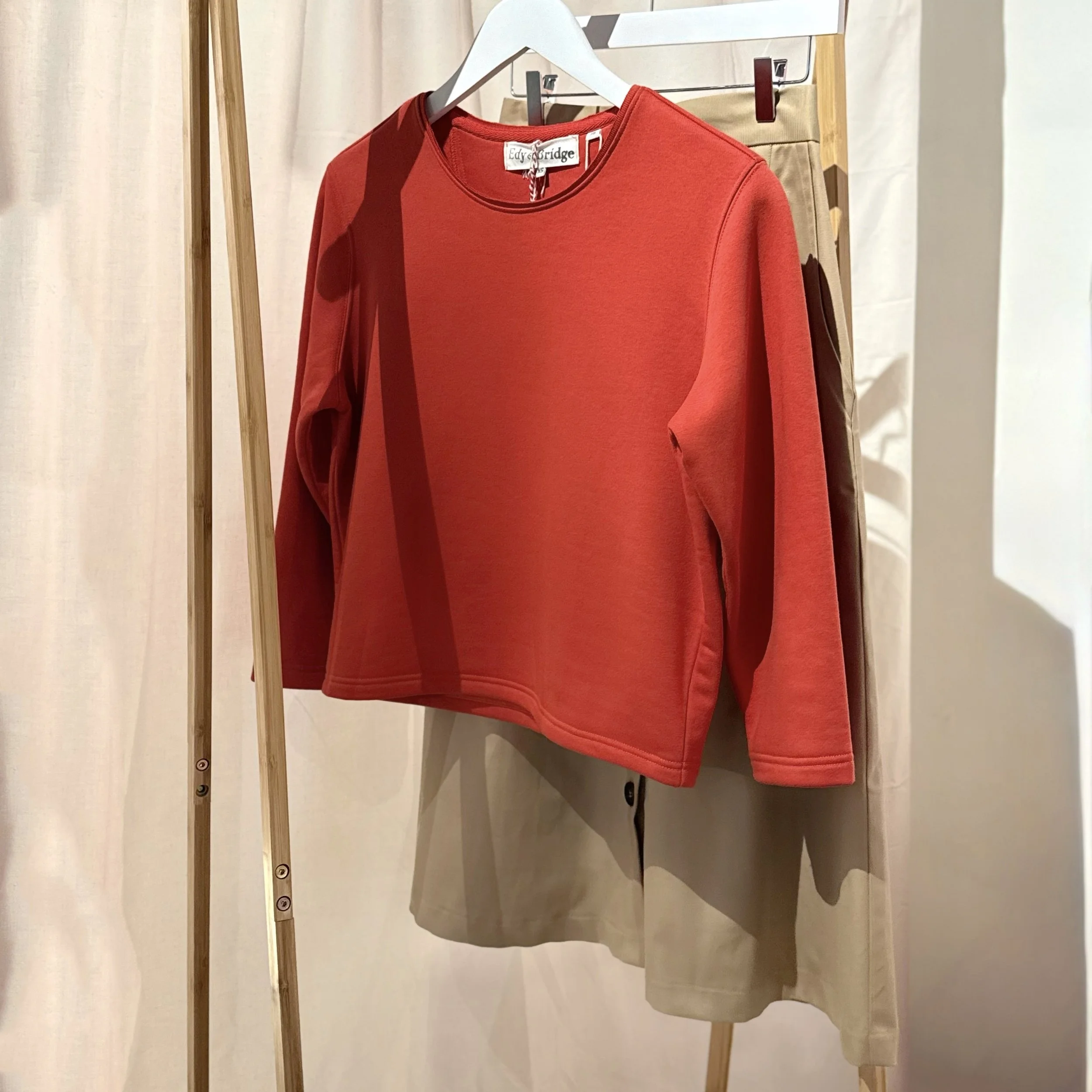 red sweatshirt with tan skirt.jpg