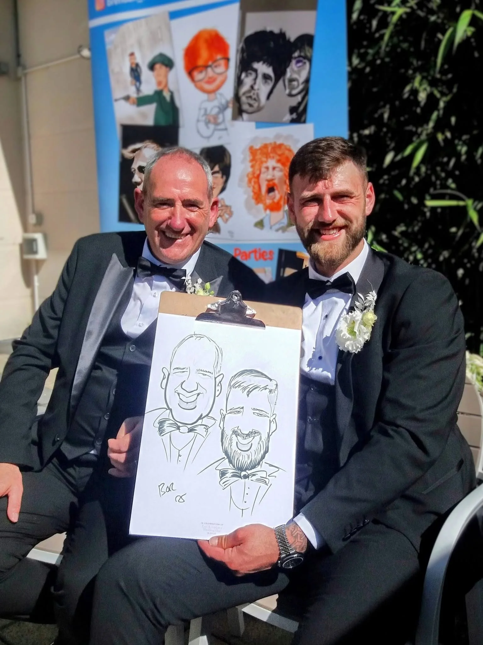 Groom and dad with their live caricature