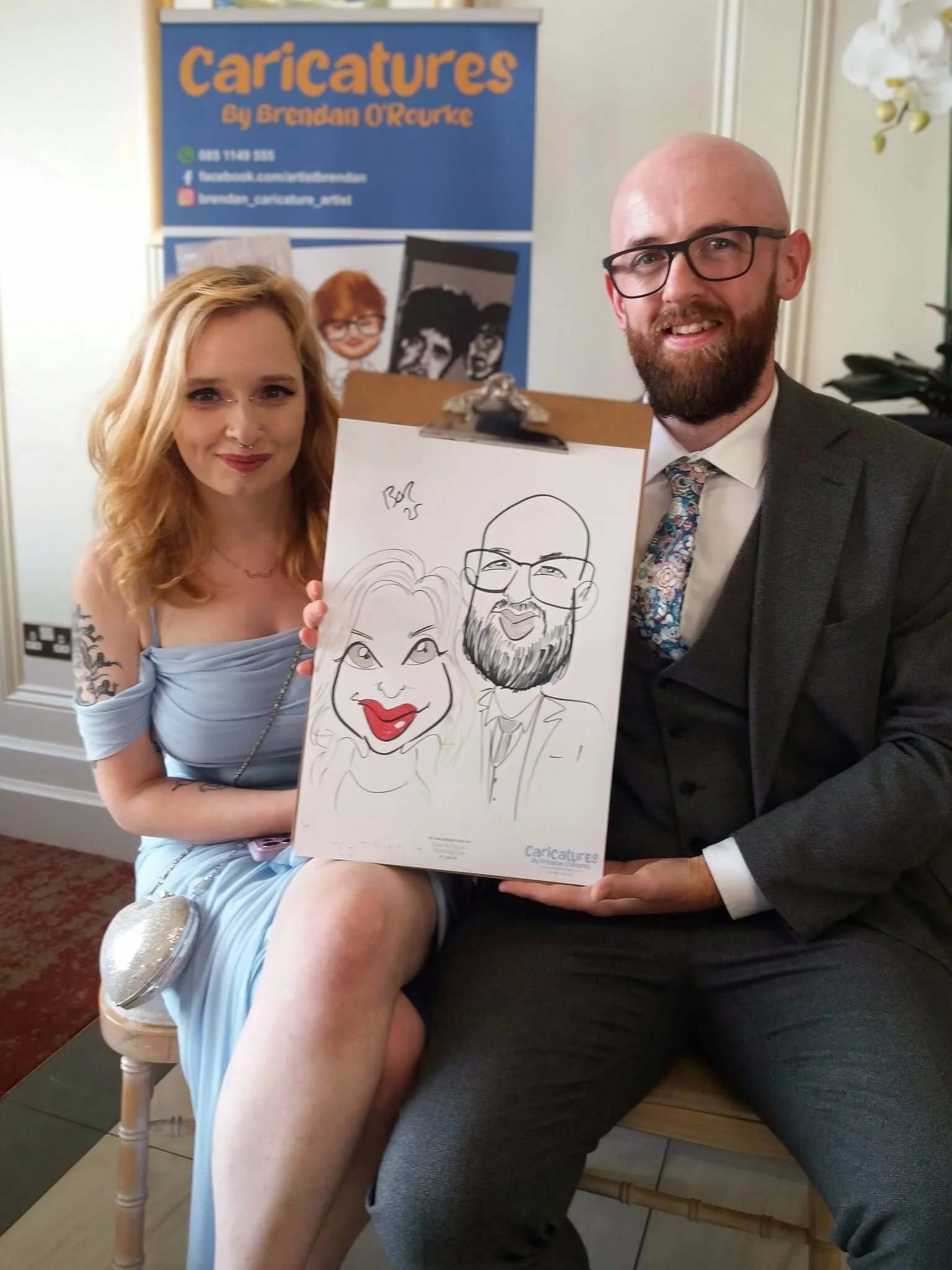 Wedding guests posing with a live caricature portrait.