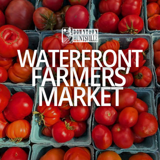 Cartons of fresh tomatoes at Waterfront Farmers Market in Huntsville.