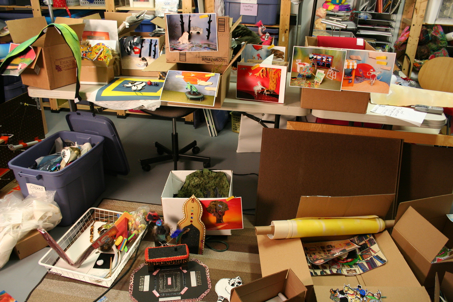 Each character and their set materials were loaded into boxes in a systematic fashion, having been photographically documented so they could be easily replicated. Backdrops were rolled onto several large cardboard tubes. It completely filled my car! 
