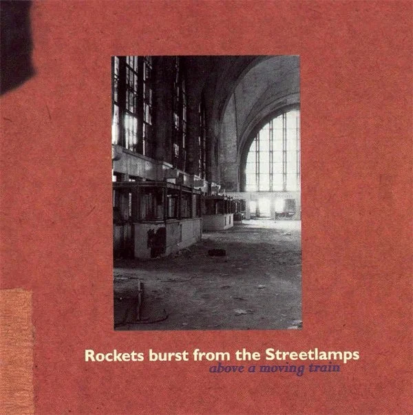 Rockets Burst from the Streetlamps - Above a Moving Train