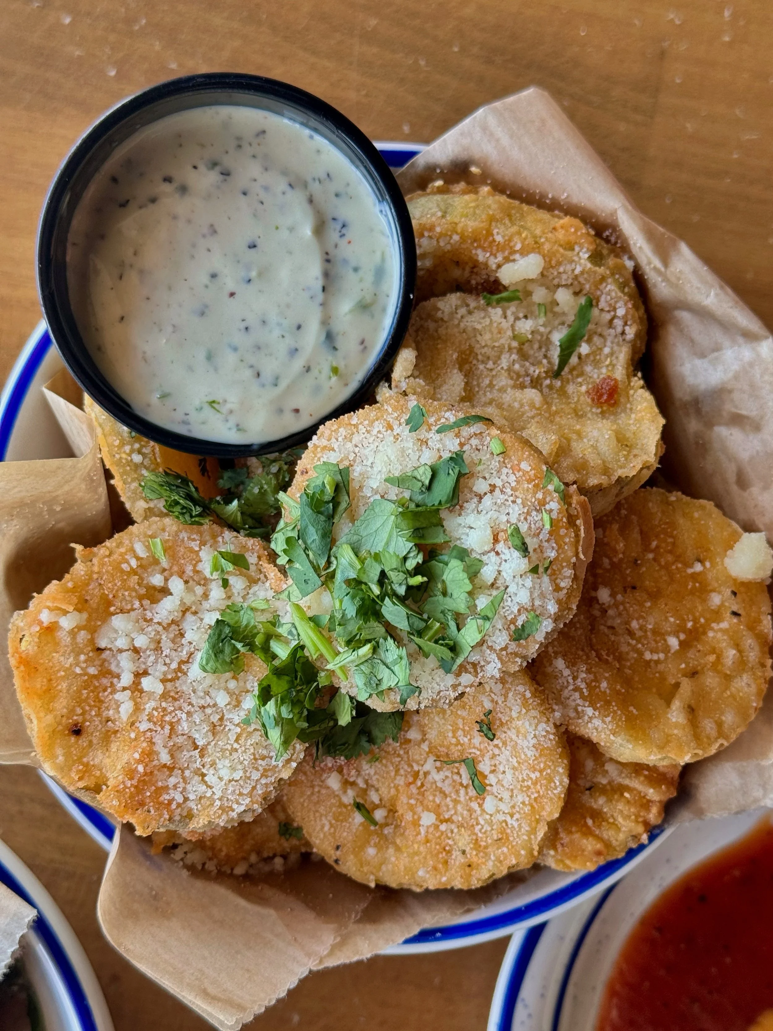We hand-bread our fried pickles and serve them with ranch, cotija cheese, and cilantro. Order some for the table&hellip;or just yourself.