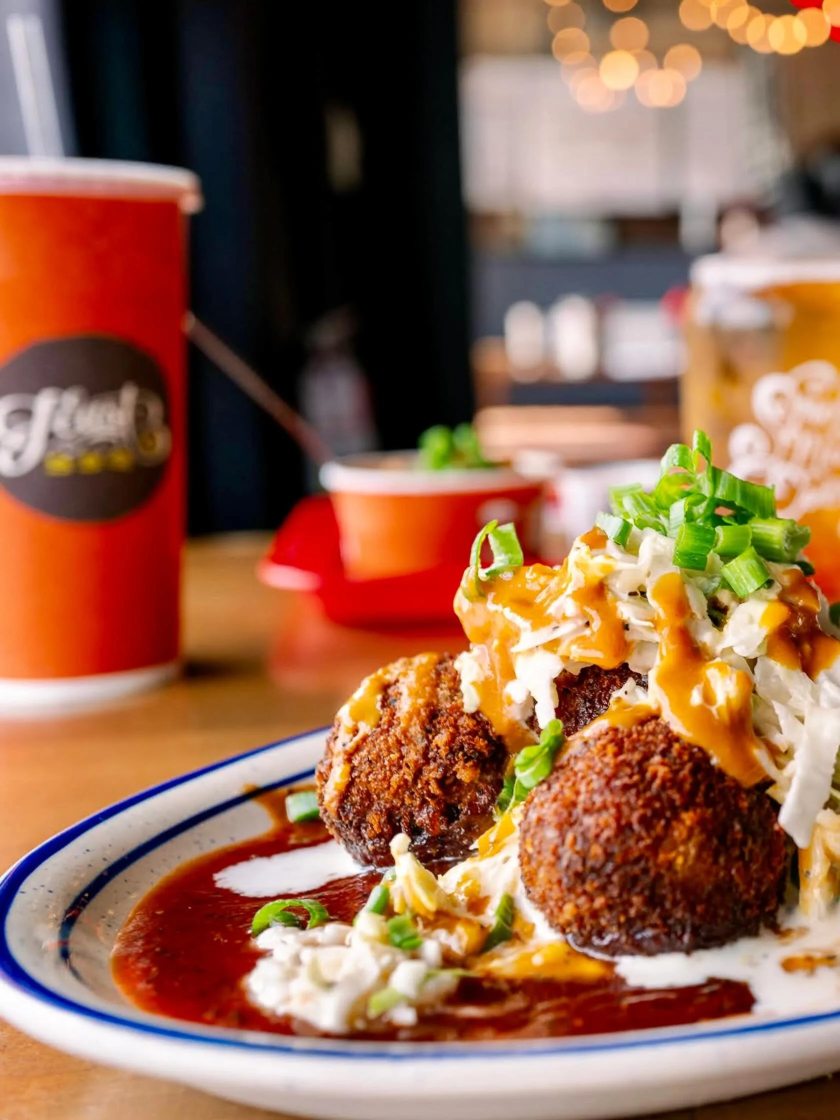 If you haven&rsquo;t tried the Pork Cake Poppers yet, add them to your order next time you&rsquo;re at the counter. You get five crispy poppers over our original BBQ sauce, topped with coleslaw and a tangy mustard BBQ drizzle.
