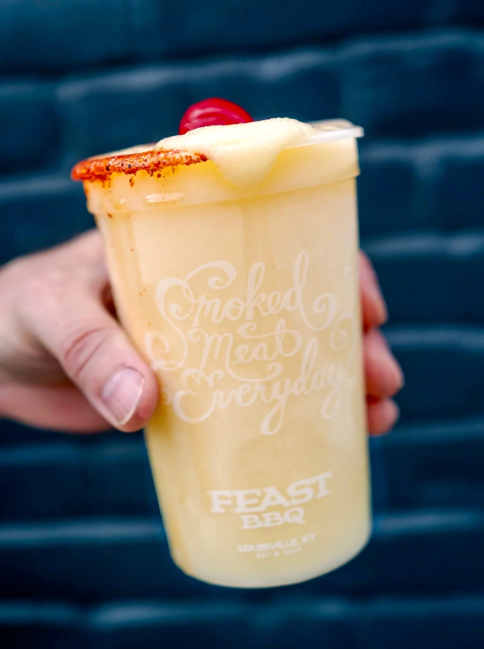 The Taj&iacute;n-a-Colada, our currently featured slushy, is a frozen blend of pineapple clime, creamy coconut, and rum. And finished with a Taj&iacute;n rim, of course.

Available for a limited time only.