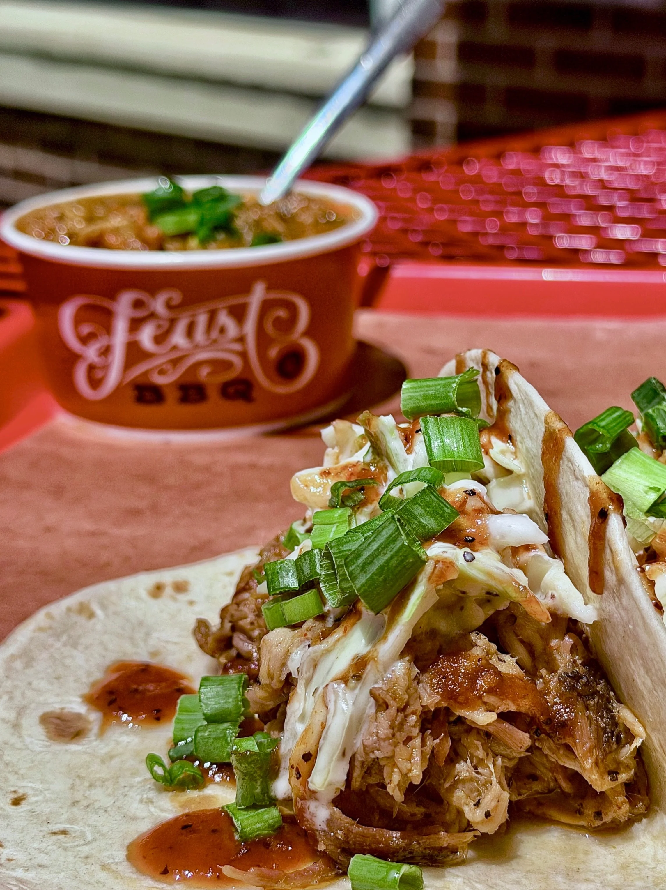 If you want something substantial but still light enough for lunch, go the BBQ-style taco route. Creamy slaw, green onions, Feast BBQ sauce, and a protein of your choice.