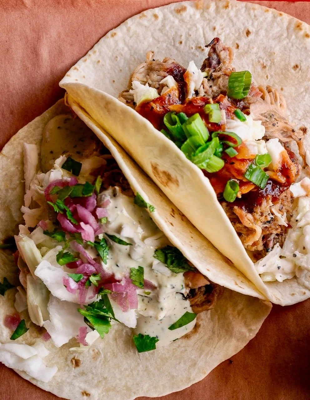 Ranch-style Tacos or BBQ-style Tacos: which one are you choosing for your protein? 

Ranch: cabbage, pickled red onions, cilantro, ranch 

BBQ: creamy slaw, green onions, Feast BBQ sauce