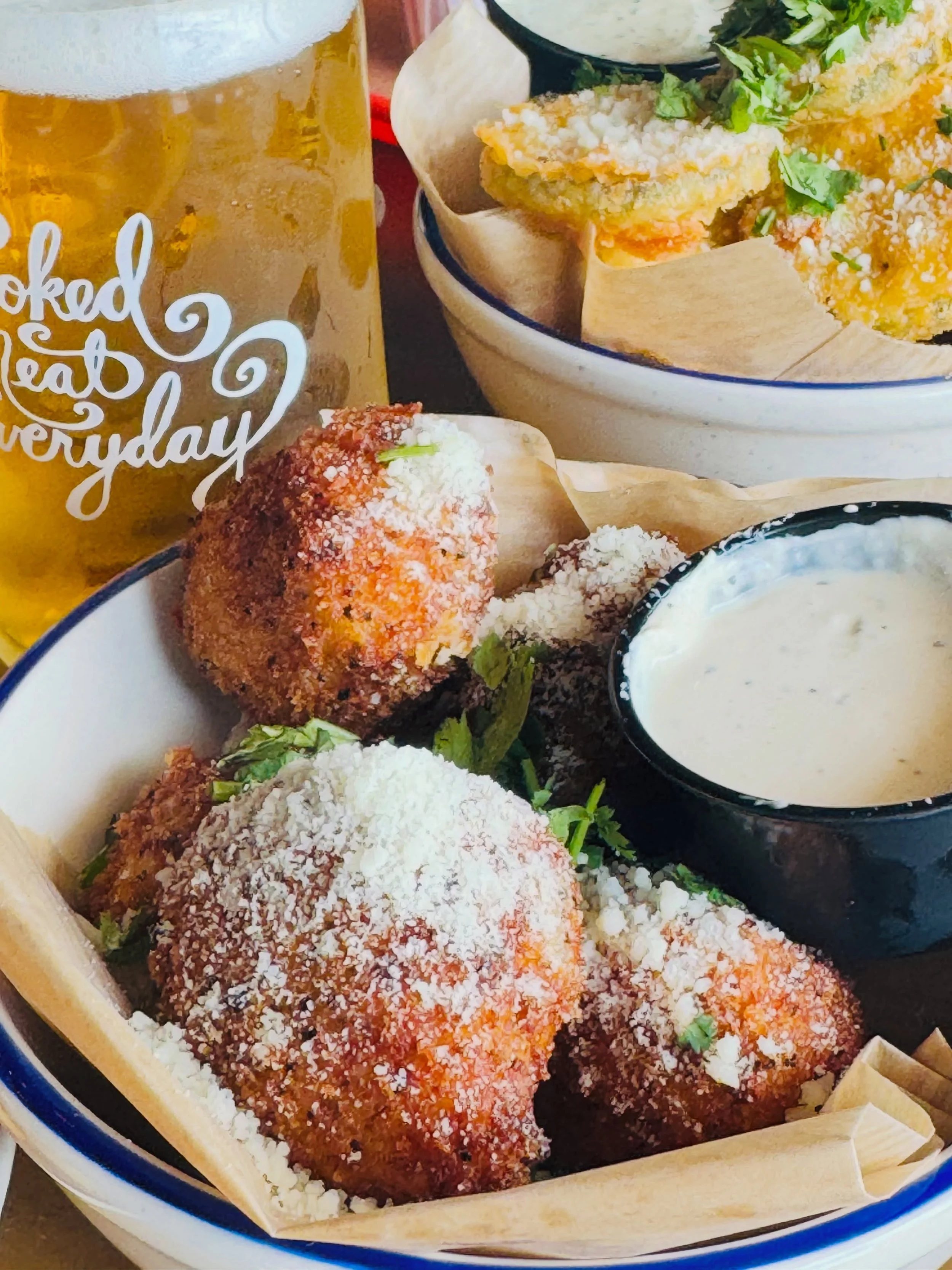 Mac &amp; Cheese Balls: everything you want in mac and cheese rolled up, fried crisp, and topped with cotija and cilantro. Dip it in horseradish sauce. No fork required.