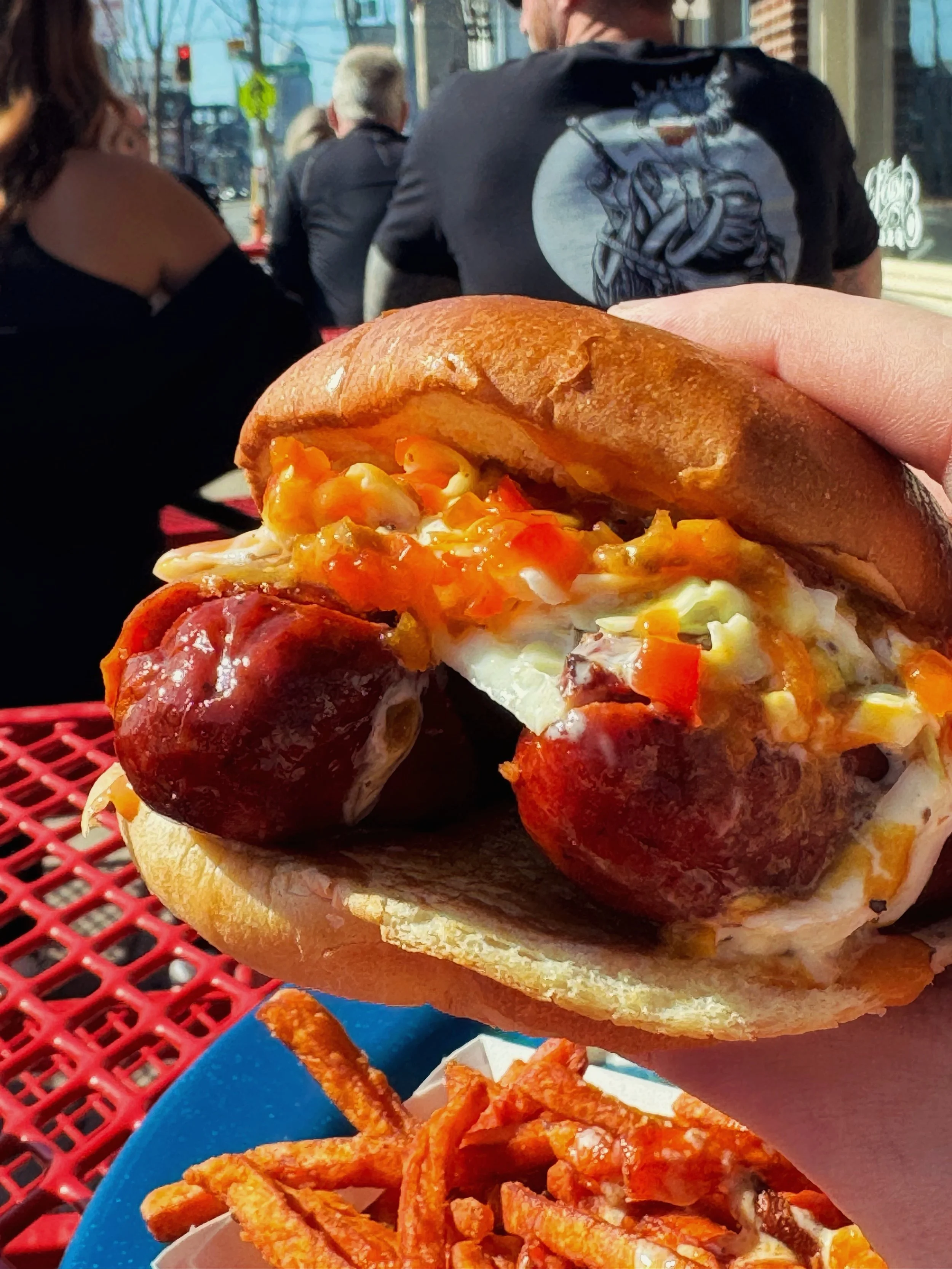 The snap of a hot link is especially satisfying when biting into a sandwich.

The Hill Country Holler includes hickory-smoked hot links, mustard bbq sauce, creamy coleslaw, and hot pepper relish.

Just start thinking about which side you want with it