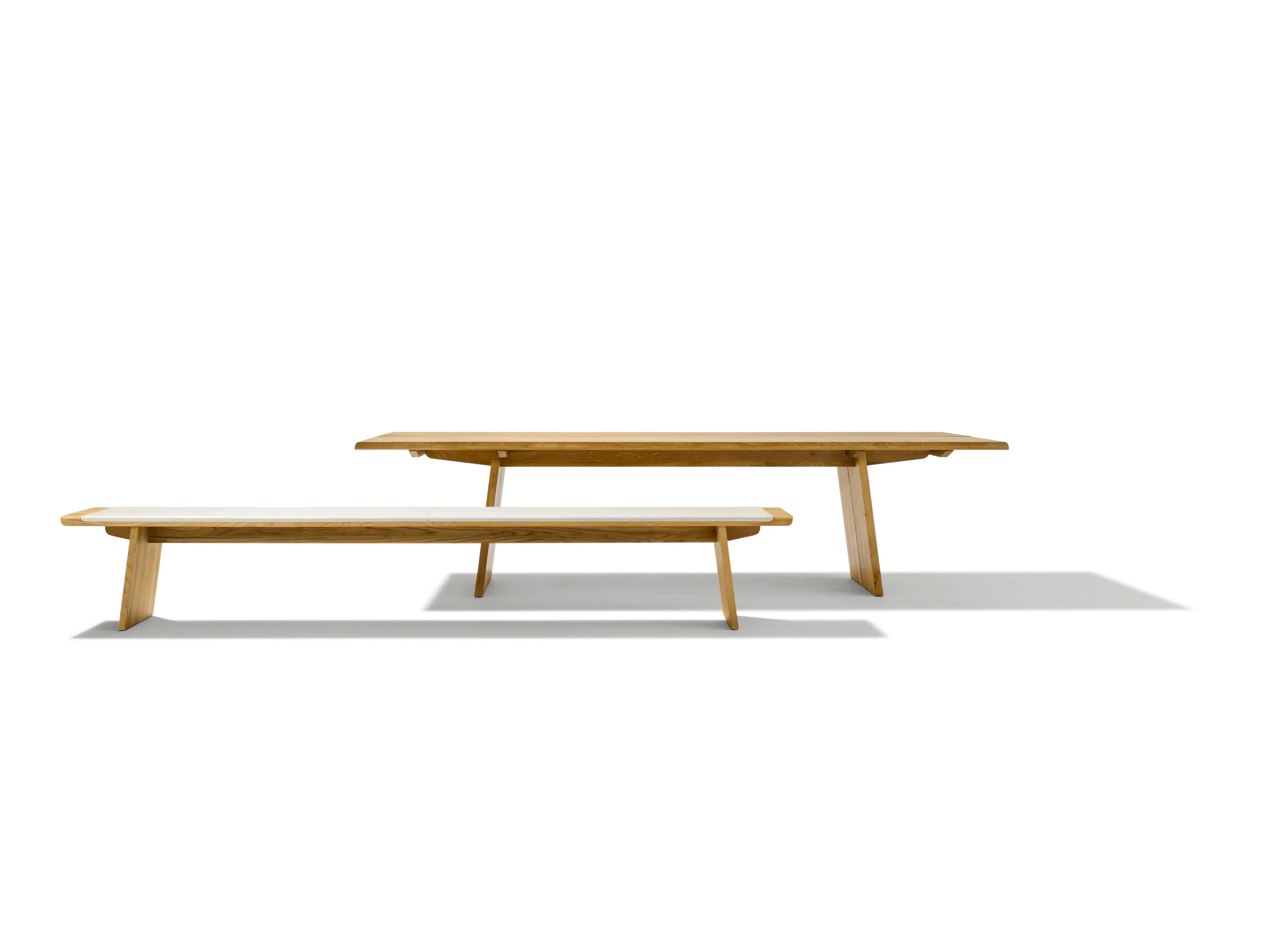 NOX table A masterpiece of nature is embodied in the nox table. Made from 100% natural wood, the nox table stands out above all through its 3.8 cm thick and up to 3 metre long tabletop. The robust oak and walnut tabletops are additionally available with wild natural look. Such natural features as knots and striking grain patterns are characteristic of this particular look. Perfectly crafted details, such as the gently rounded S-shaped edges of the corners, underline the table's first-class quality. The longitudinal join in the centre of the table can optionally be covered with a metal pilaster strip. Text/Photos/Producer: TEAM 7 Design: Jacob Strobel 2010