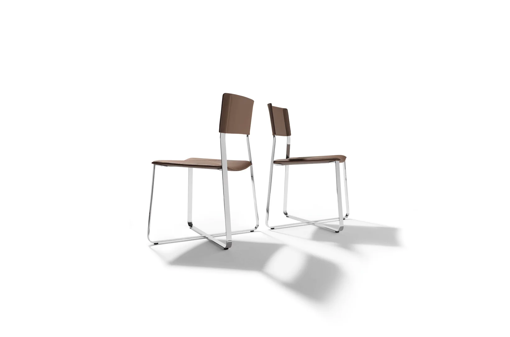 LUX chair The lux bar chair stands out thanks to its 'moving' seat concept and its design which is based on classic square and cross design elements. The sophisticated design allows you to gently 'swing' in any direction and the lightly padded seat adds to this innovative seating sensation. Text/Photos/Producer: TEAM 7 Design: Jacob Strobel 2008