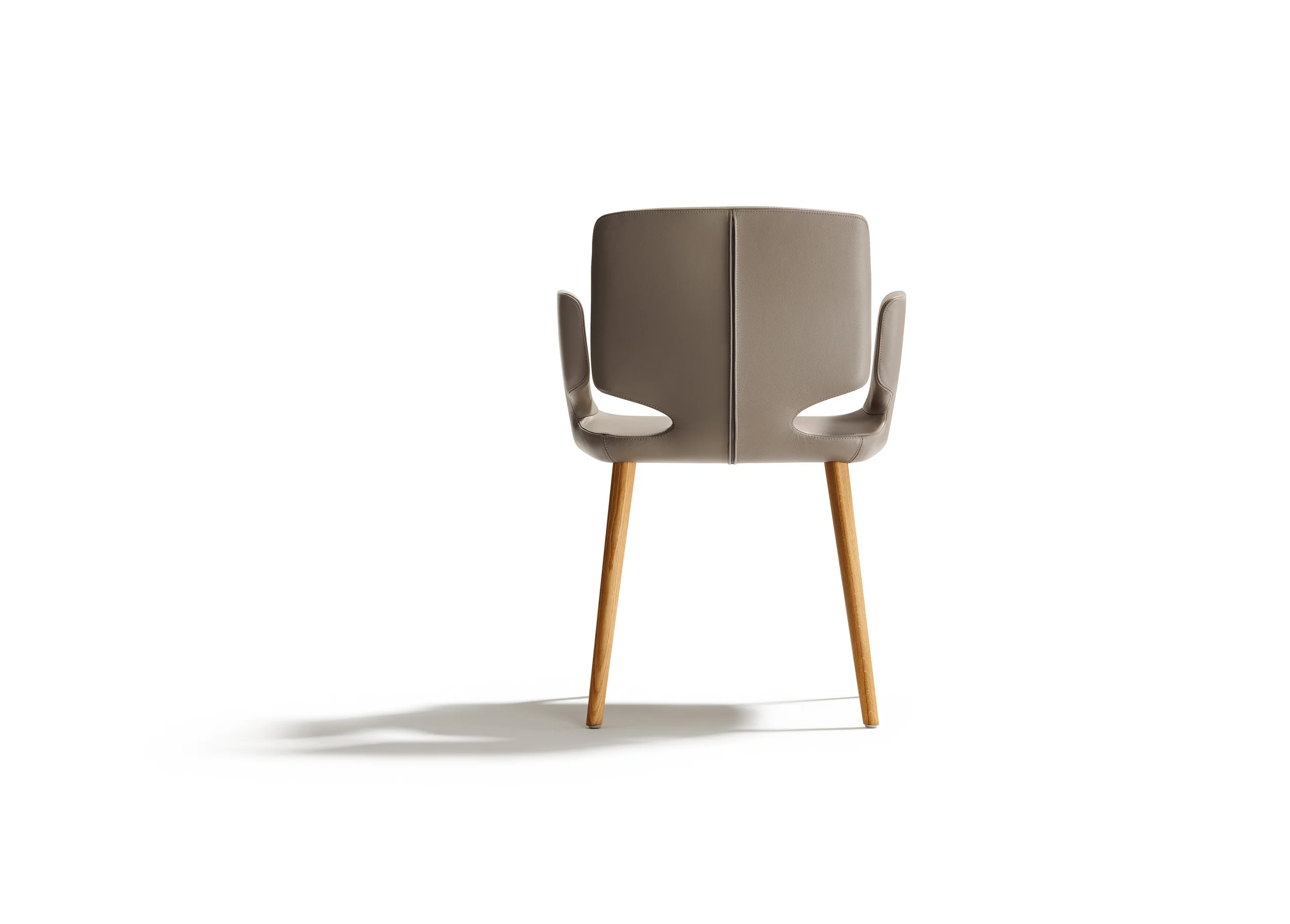 AYE chair Aye, aye Sir. The new aye chair is a perfect blend of beautiful forms and comfort. Fine leather seams to encompass this slender upholstered chair, while precisely defined edges ensure interplay with the generous curve radii. The striking sidecut of the backrest gives aye an airy appearance, while also functioning as an area from which to hold and move the chair. The flexible backrest, ergonomic armrests and soft, comfortable seat mean sitting at the table will definitely not be a chore. Text/Photos/Producer: TEAM 7 Design: Jacob Strobel 2012
