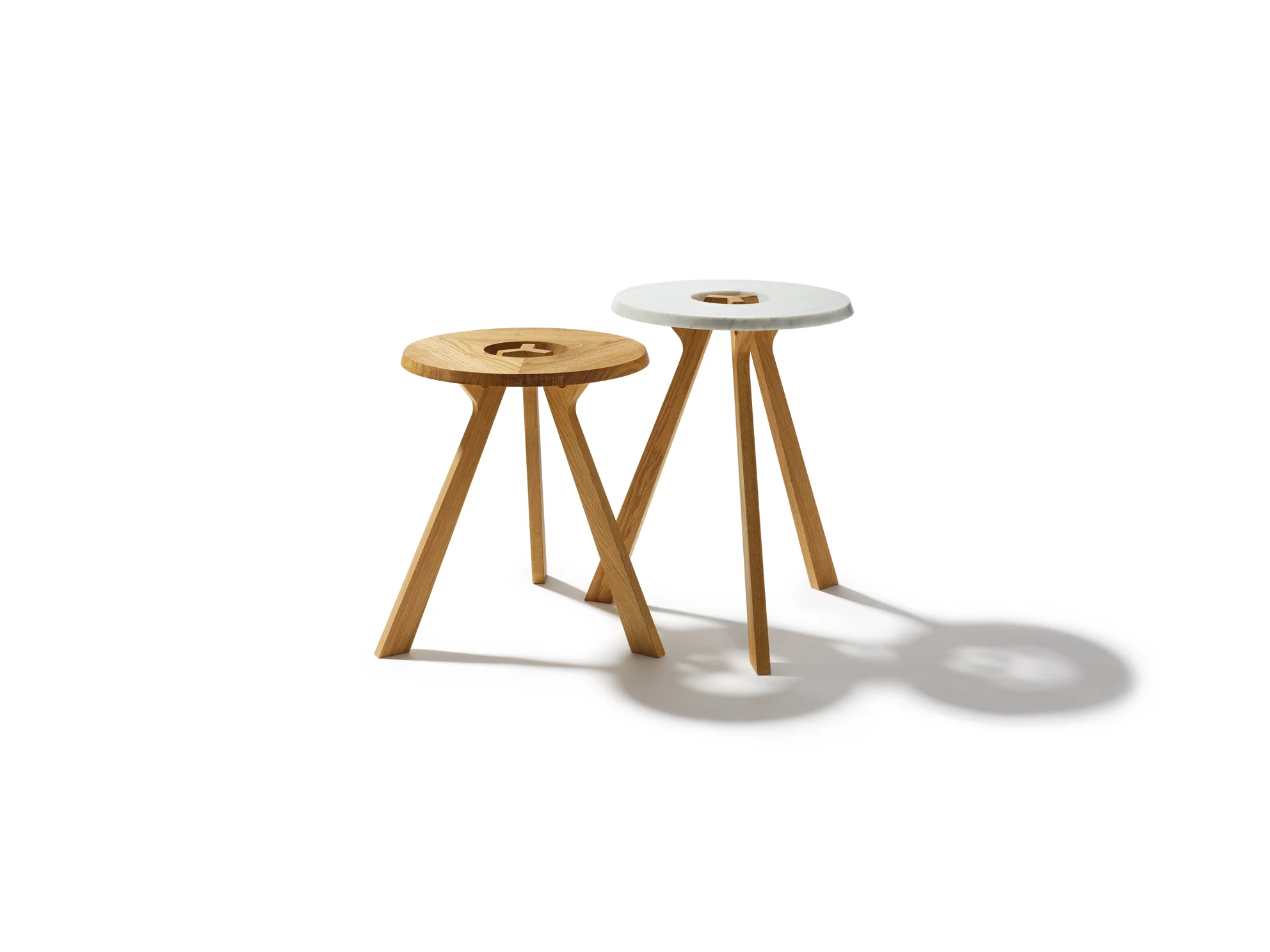 TREEO SIDE TABLE Your flexible companion from the forest. Some describe it as three narrow tree trunks that join together and with their branches support a crown made of natural wood or white marble; others simply call it an award-winning and extremely flexible side table. Both are right. The design element central to the treeO is the circular recess on the table top, which showcases the end-grain pattern of the table's legs and the elegant wooden joints. This sophisticated feature also serves as a practical carrying handle. Whether free-standing or arranged as part of a group, its two convenient heights and its mobility make the treeO side table the perfect addition to all living areas. Text/Photos/Producer: TEAM 7 Design: Sebastian Desch, Stefan Radinger, Jacob Strobel 2014