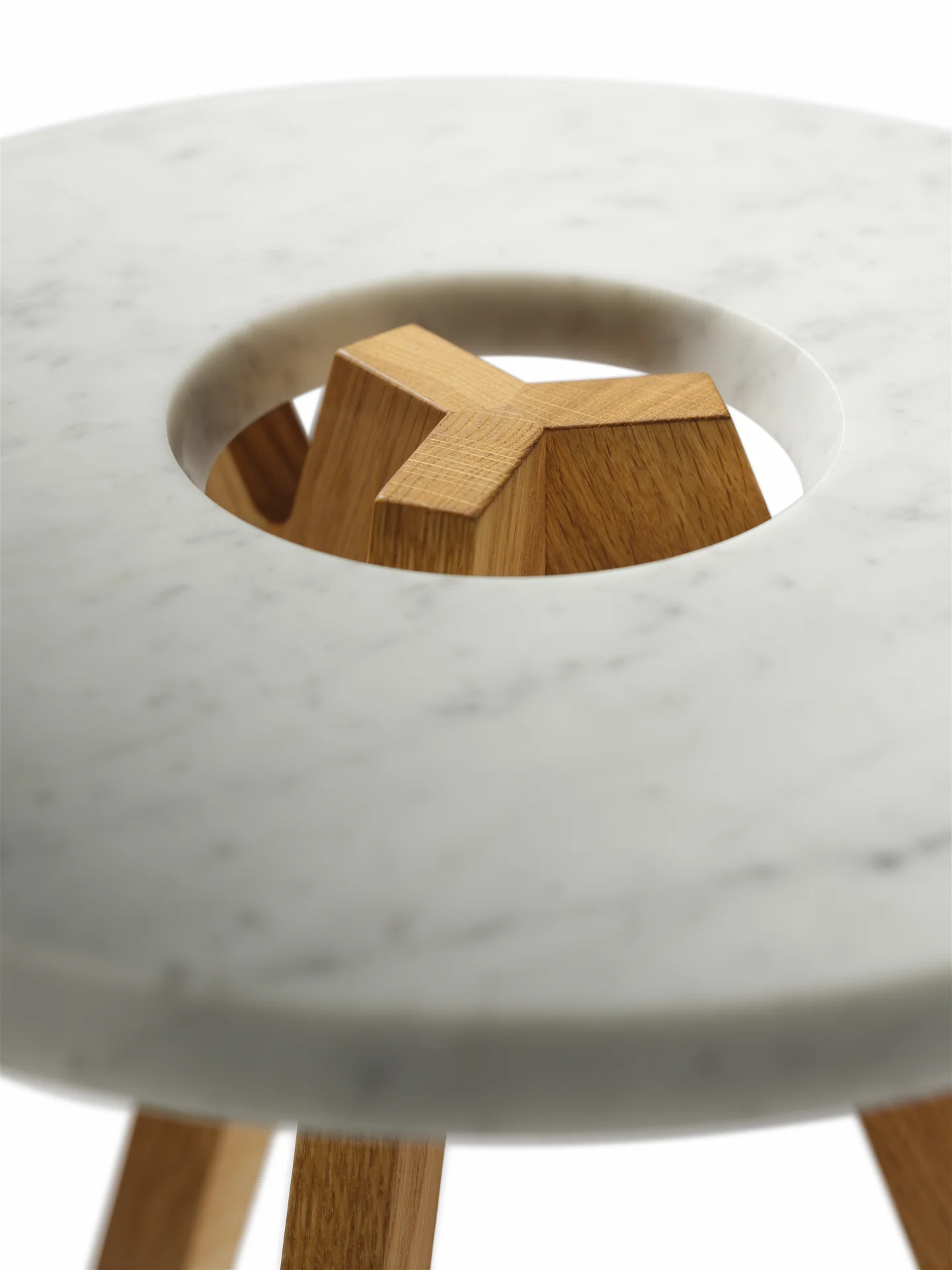 TREEO SIDE TABLE Your flexible companion from the forest. Some describe it as three narrow tree trunks that join together and with their branches support a crown made of natural wood or white marble; others simply call it an award-winning and extremely flexible side table. Both are right. The design element central to the treeO is the circular recess on the table top, which showcases the end-grain pattern of the table's legs and the elegant wooden joints. This sophisticated feature also serves as a practical carrying handle. Whether free-standing or arranged as part of a group, its two convenient heights and its mobility make the treeO side table the perfect addition to all living areas. Text/Photos/Producer: TEAM 7 Design: Sebastian Desch, Stefan Radinger, Jacob Strobel 2014