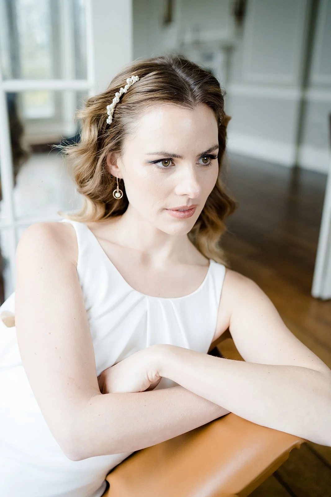 A pair of versatile beaded bridal hair combs featuring pearls and
