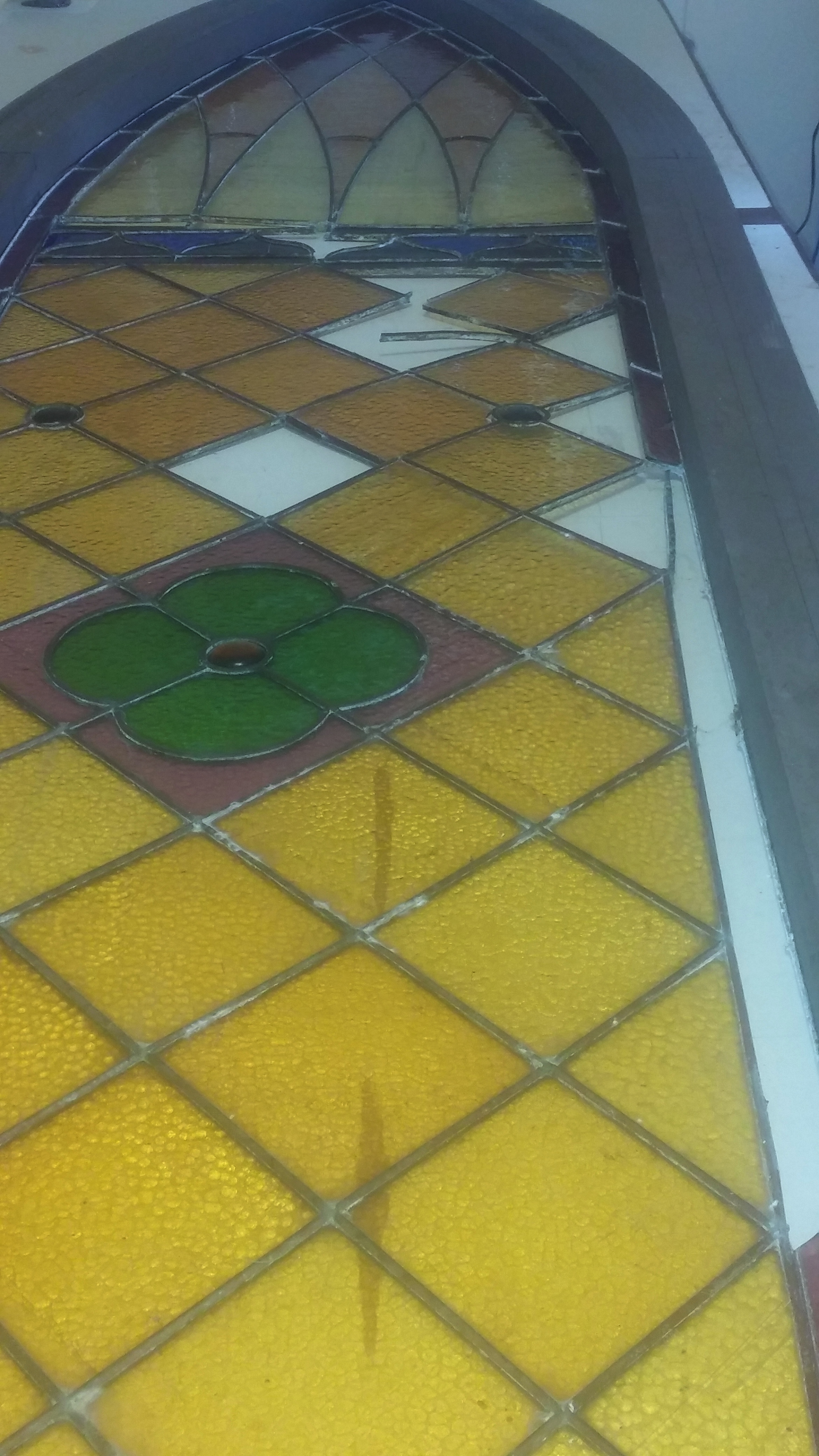 Pieces of glass removed for matching and repair...