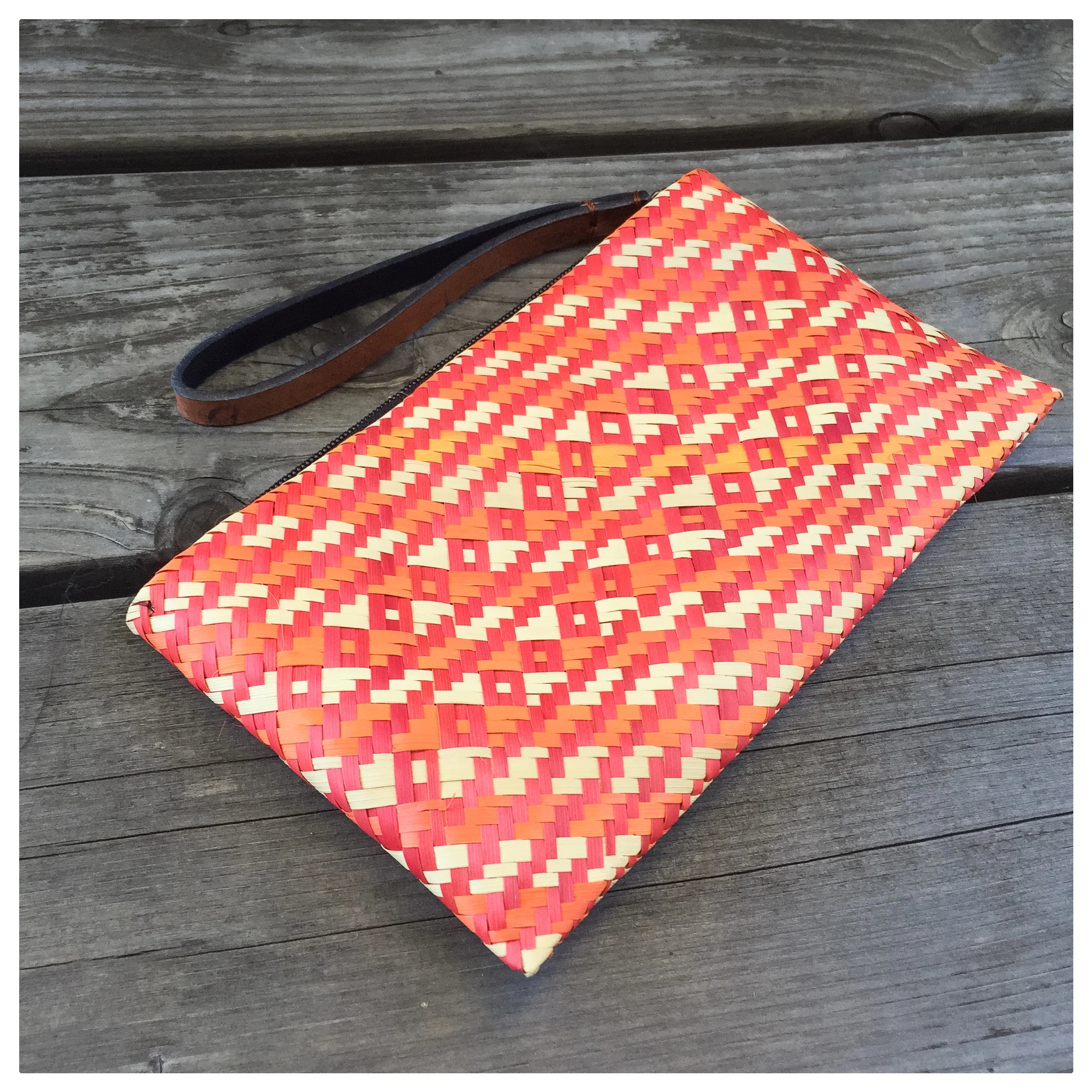 The Ruby Wristlet is handmade from grass by women in Uganda. It is large enough to hold your phone, keys, and more. 8" x 5". Special thanks to Julie at Cobalt Collective for supporting Reeds of Hope! Check out their shop for more beautiful gifts that make a difference! 