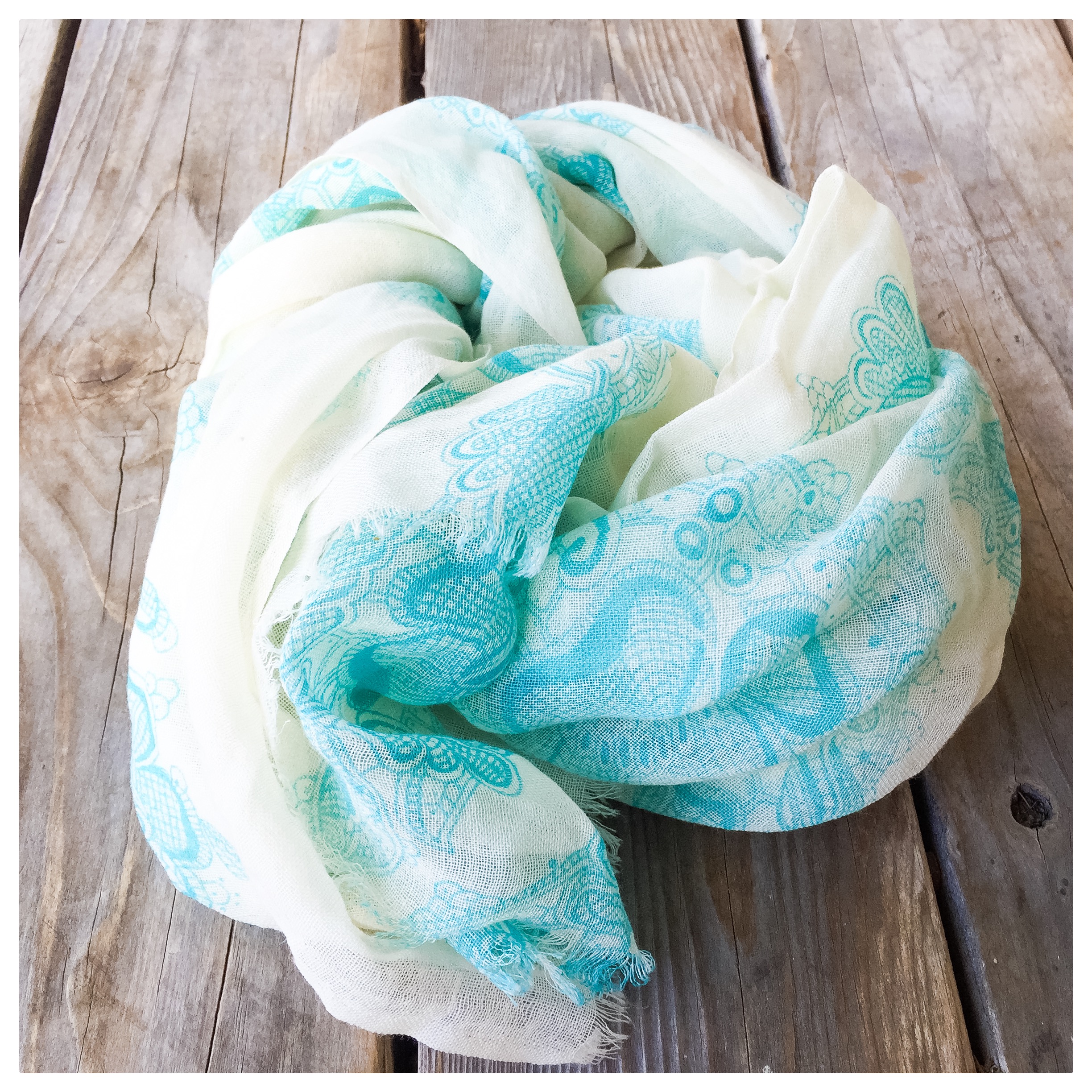 Donated by a generous friend, this aqua and cream colored Bindya NY scarf is the perfect accessory. Lightweight and sophisticated, it is a blend of silk and wool. Inspired by international travel, we hope you love this scarf as much as we do. 