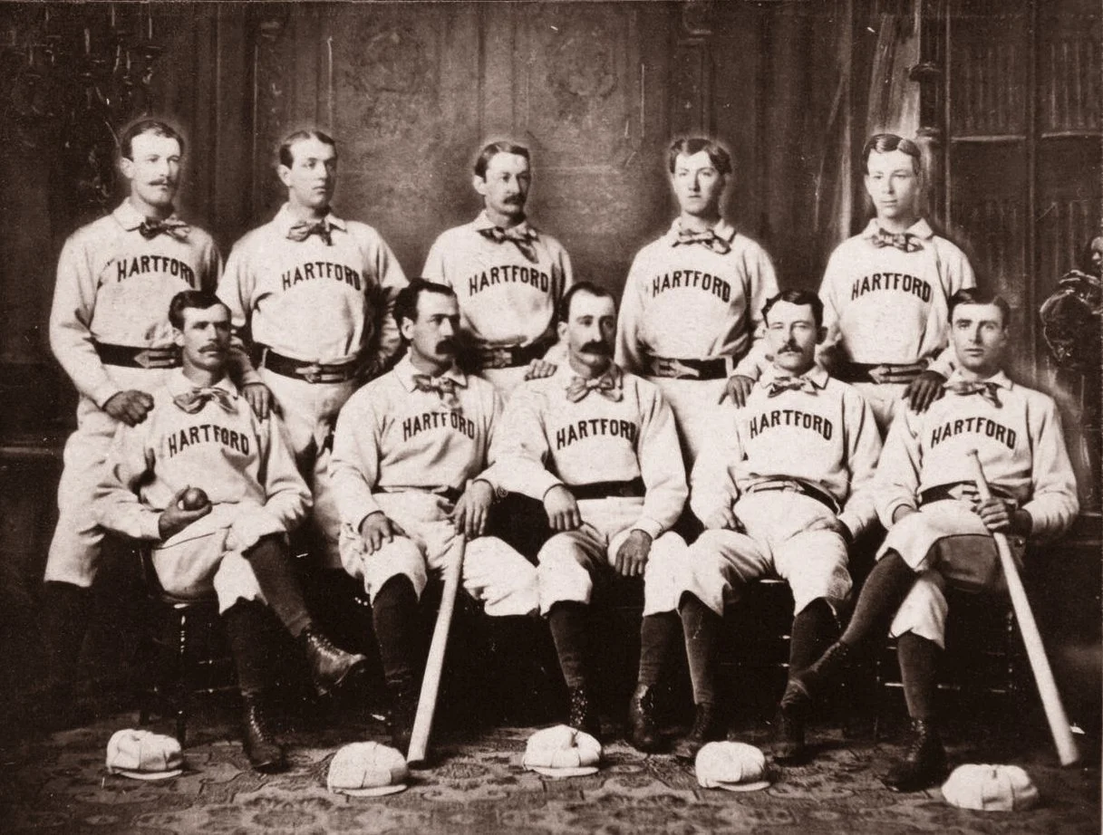 1875 Hartford Dark Blues L to R, Standing: Jack Remsen, Tom York, Candy Cummings, Tommy Bond and Bill Harbridge. Seated: Doug Allison, Everett Mills, Bob Ferguson, Tom Carey and Jack Burdock.