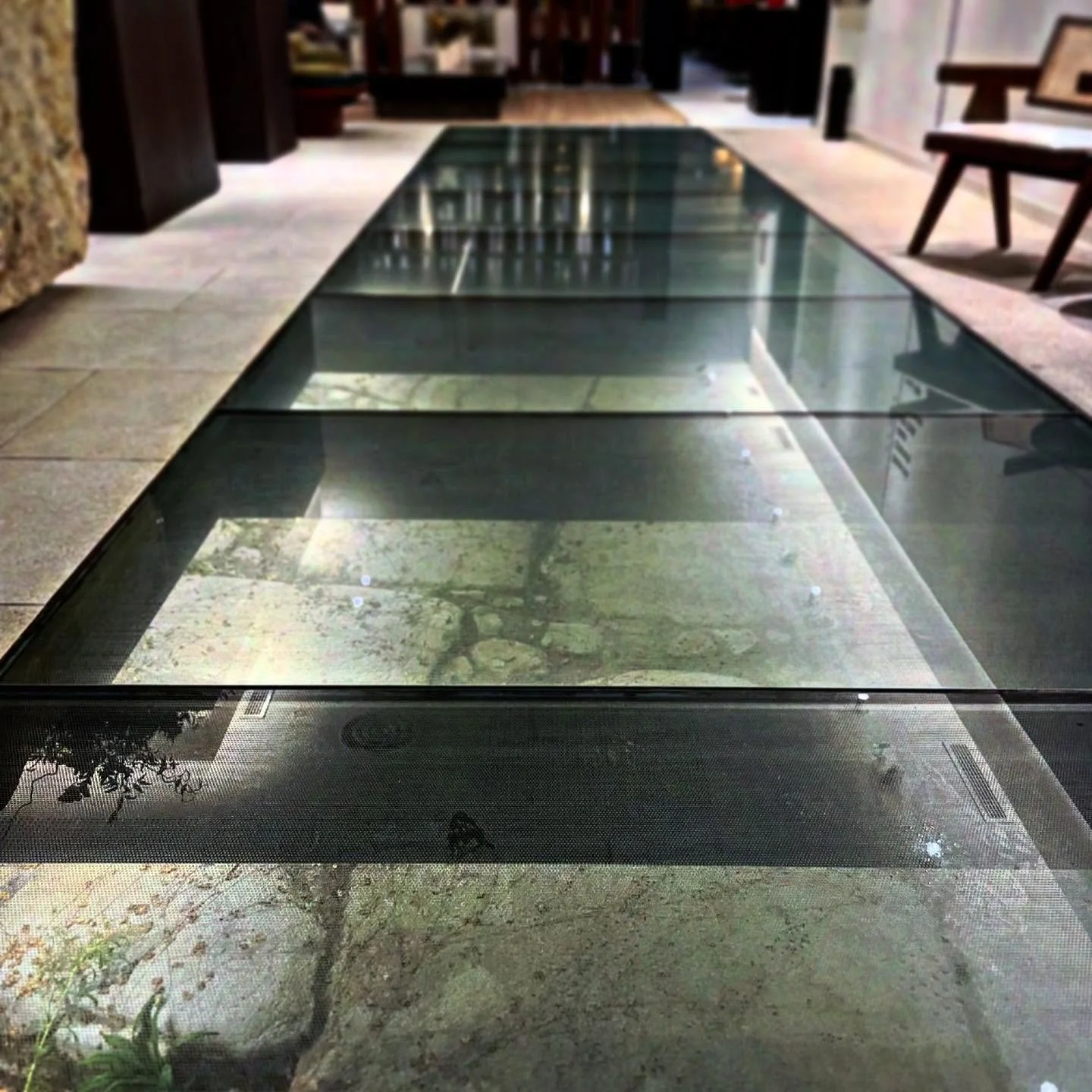 Roman Road Lobby.  When building this boutique hotel, they discovered a Roman road in the middle of the footprint.  Solution: build it into the plan.  #boutiquehotels #historichotel #uniquehotels #NorthernSpain ##Spaintrip #Spaintour #customtours #pr