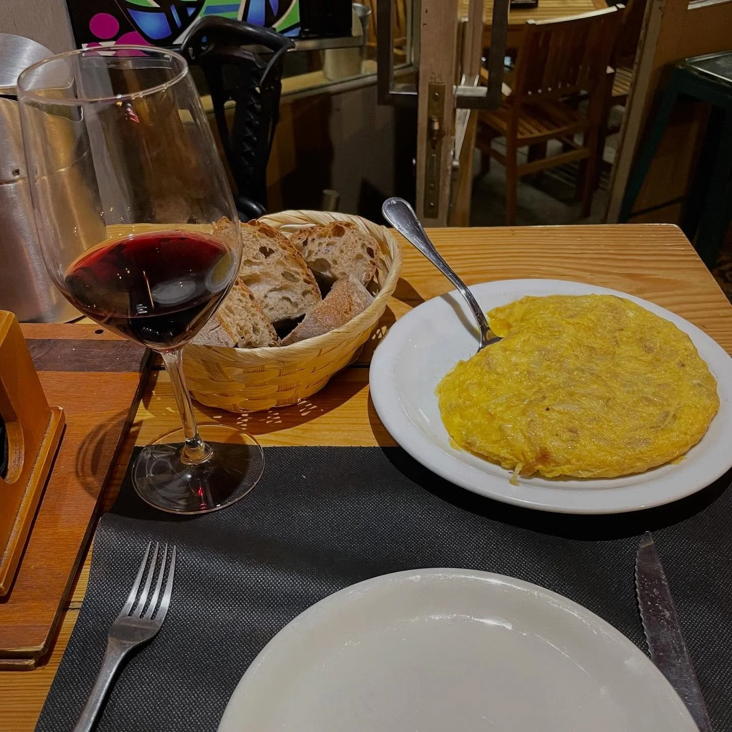 Perfect Dinner. Spanish tortilla (egg/potato/onion omelette), runny in the middle like I prefer , glass of my favorite Galician red wine, Mencia of course and thick country bread for sopping.  Perfection. #food #wine #foodie #simplefoods #comfortfood