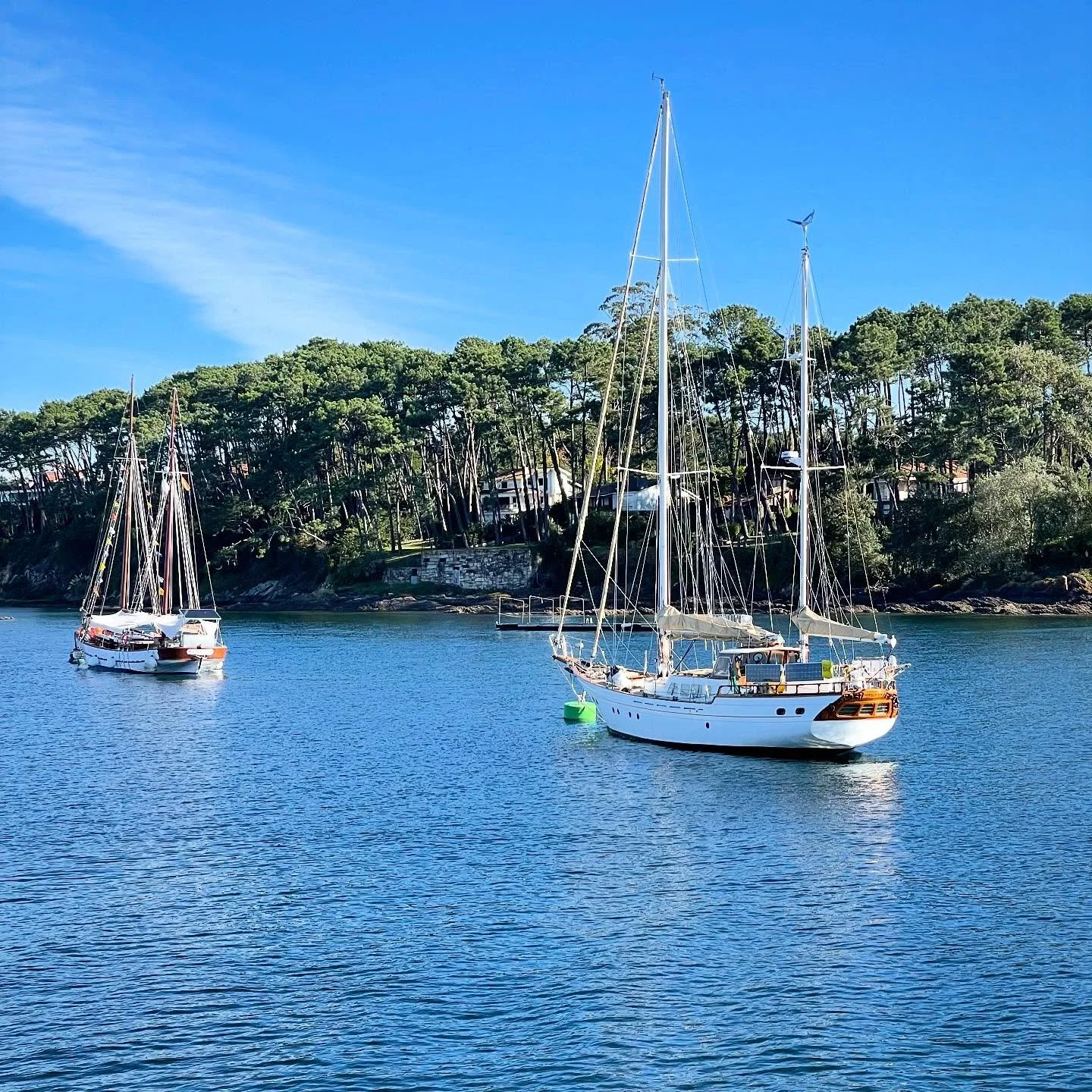 Safe Harbor. Exploring the coast of #NorthernSpain you encounter a succession of ever-changing seascapes: secluded coves, busy estuaries, islands, cliffs,, beaches, headlands, fishing villages&hellip;beautiful sailboats&hellip; #sailboat #woodensailb