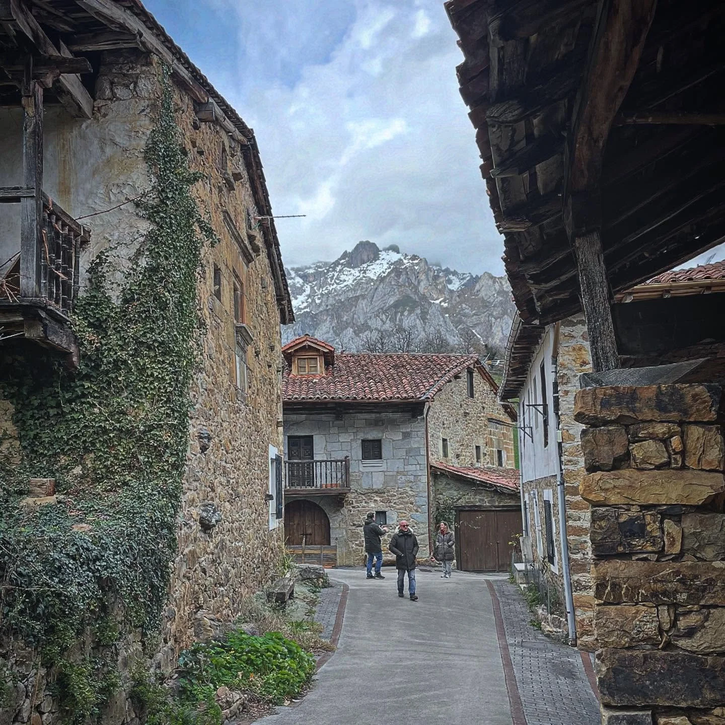 Mountain Past.  Wandering quaint, quiet mountain villages. Smoke from a few chimneys but just us, the old stone walls and the majestic snowy peaks.  Love this time of year. #NorthernSpain #mountainvillage #mountains #village #privatetour #customtours