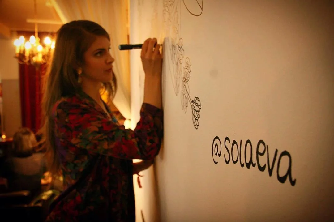Sólveig Eva drawing a mural during the Fringe Opening Party. Photo by Sveinlaug Sigurðardóttir. 