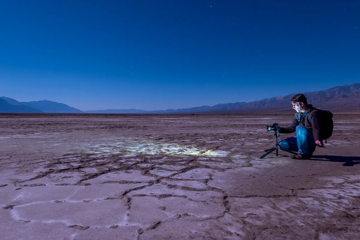 Using my Coast Portland focusing light on the Death Valley salt pans a couple of nights before the workshop began. Also note my Manfrotto Series 1 Traveler tripod, my Nikon D750 and Peak Design Everyday Backpack. Four sponsors in one photo, totally unplanned! See, we really do use this stuff! Photo by Chris Nicholson.