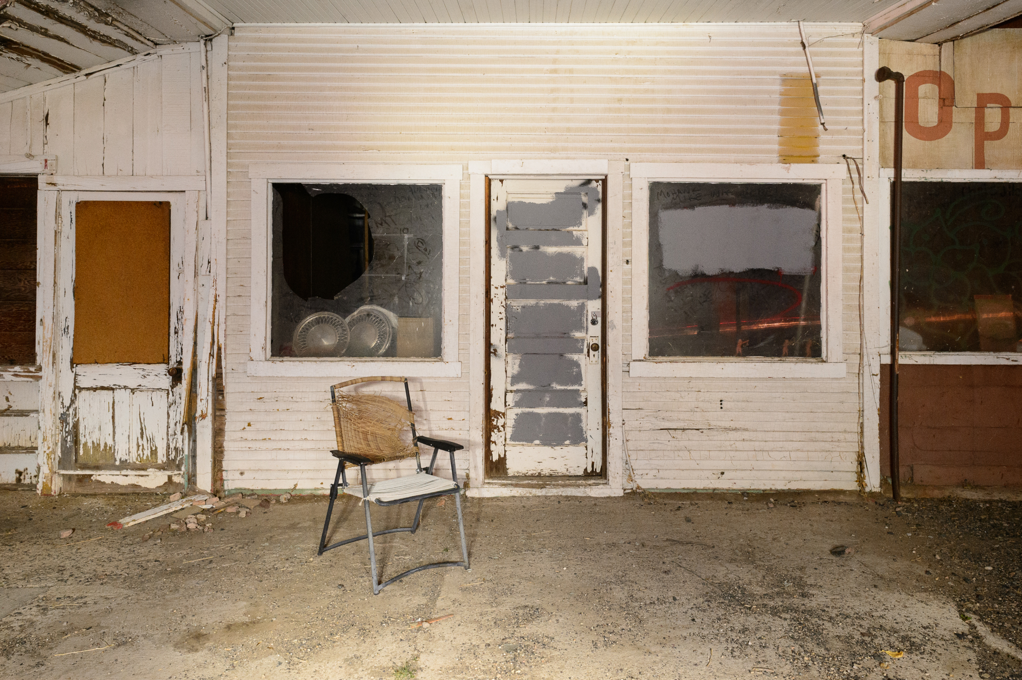 Figure 5. This old gas station in rural Arizona was illuminated using only a flashlight. There were no city lights to influence the overall exposure, but the moonlight was moderate, so I used an exposure of 2 minutes, f/11 to keep the ambient light low. In this image, I light painted from the front ...
