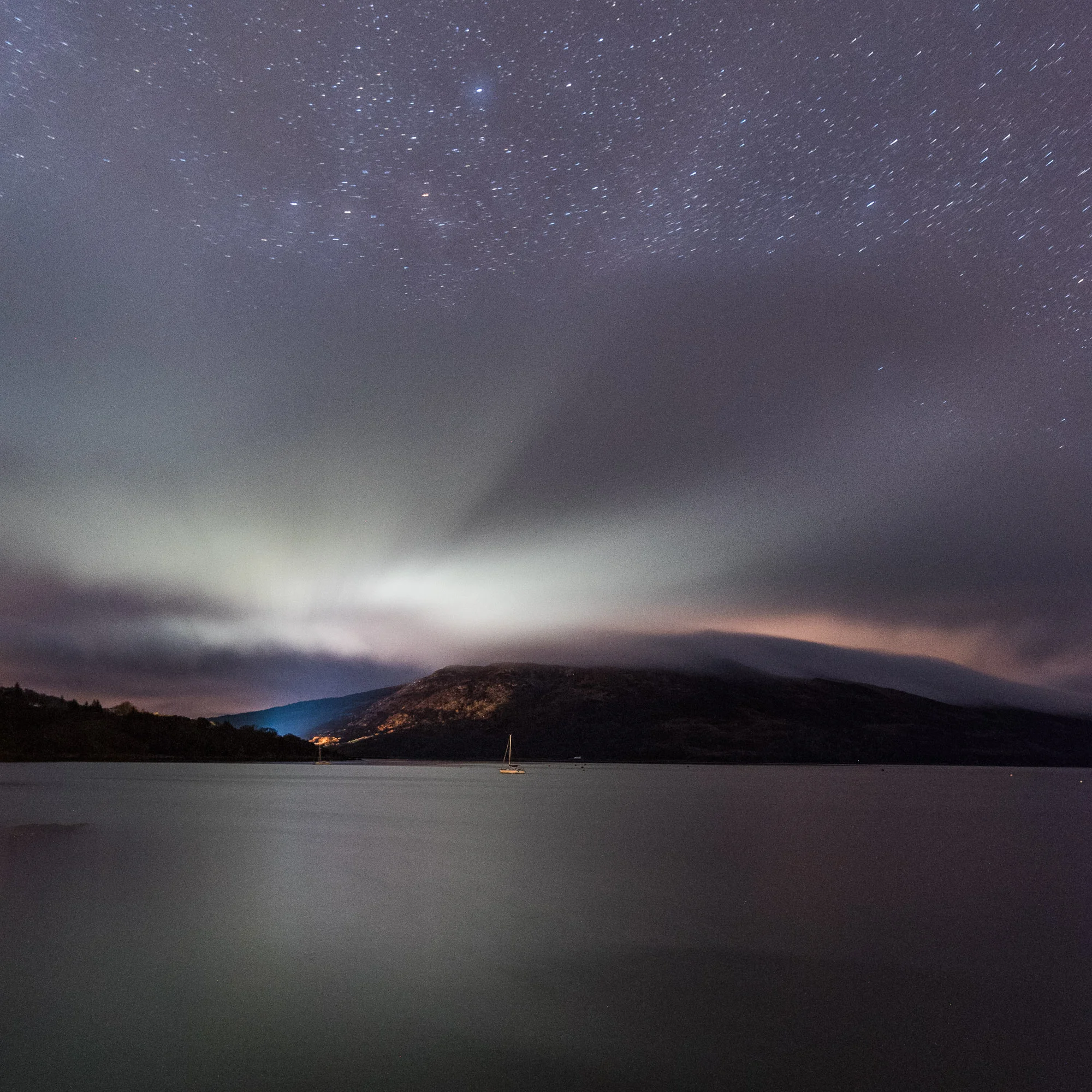 2 minutes, f/4, ISO 6400. Star points, clouds and light pollution over the Sound of Rassay on the Scotland’s Isle of Skye.