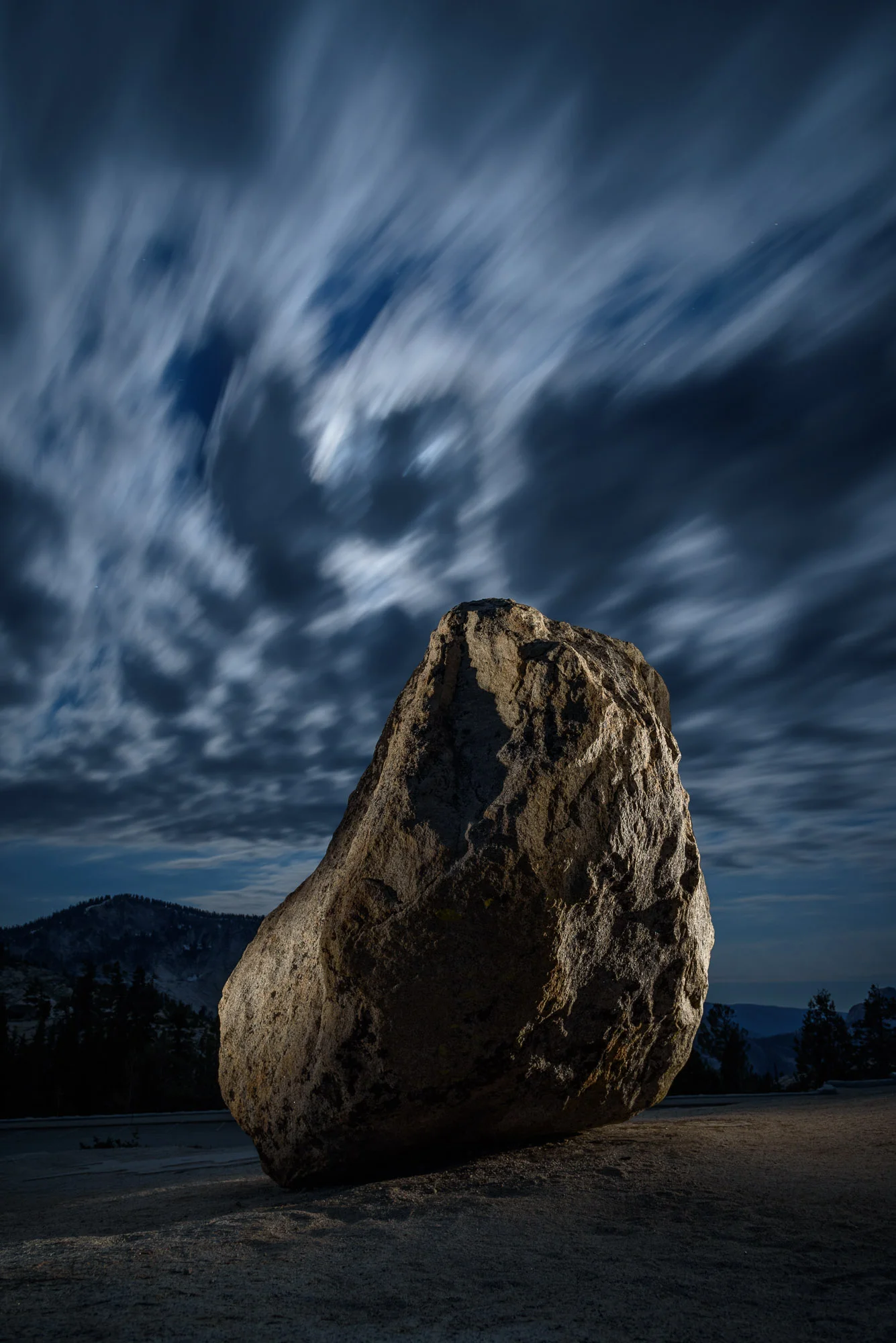 Steve’s Rock, Olmsted Point, Yosemite National Park. 30 seconds, f/5.6, ISO 800. Clouds back-lit with moonlight high in the Sierra with light from a Coast HP5R filtered with two gels, a 1/2 CTO and a 1/8 minus green .