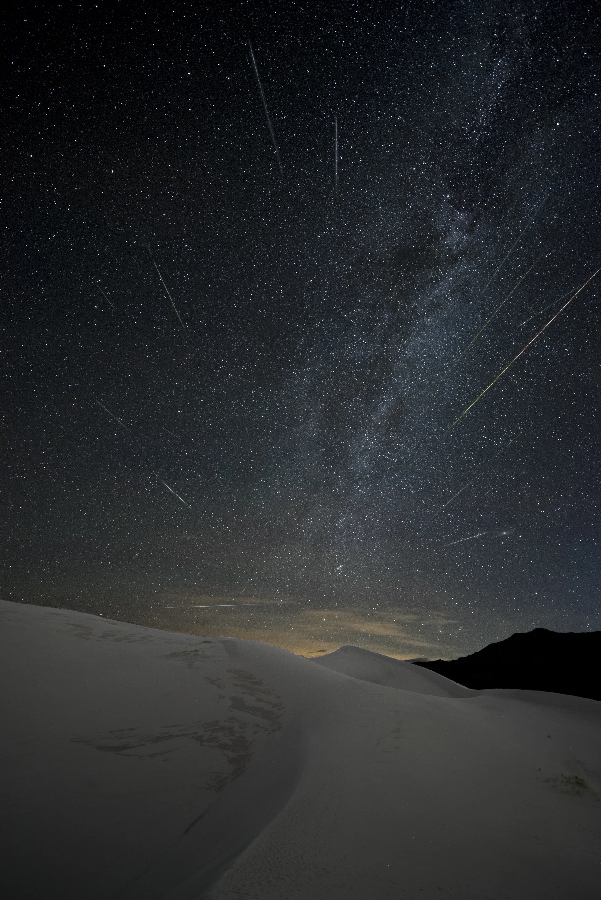 Great Sand Dunes National Park, Colorado. Nikon D750 , 15mm Zeiss Distagon f/2.8 lens. 234 images at 22 seconds, f/2.8, ISO 6400, plus a single exposure at 382 seconds, ISO 2000 for the landscape after moonrise. Photo © 2017 Matt Hill.